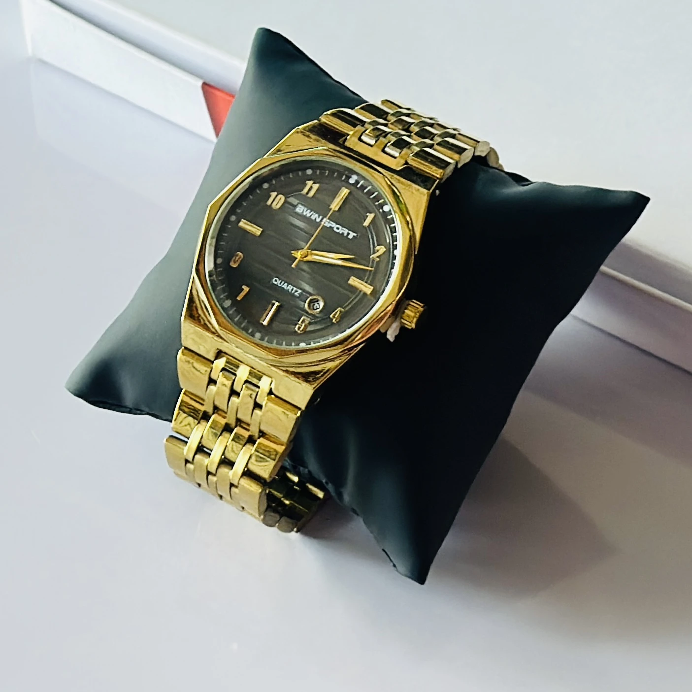 Gold tone AWIN SPORT quartz analog watch for men with a metal strap.