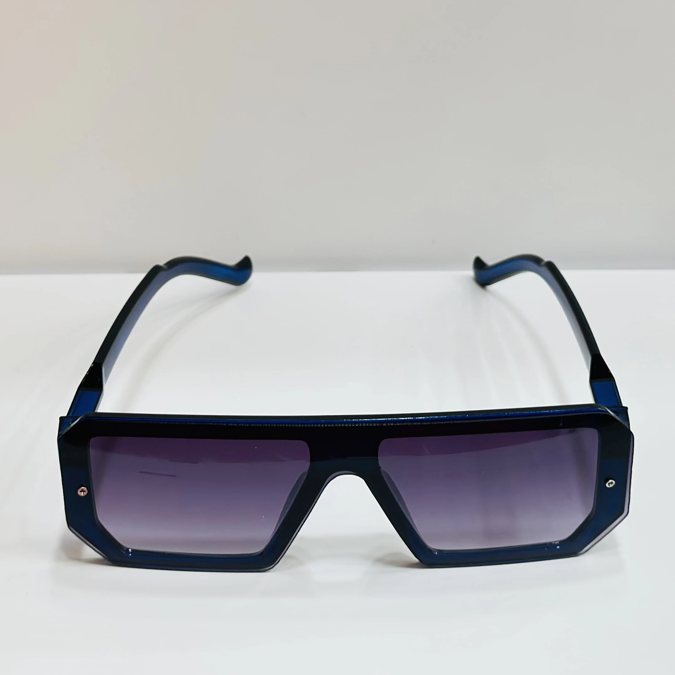 black polycarbonate oversized rectangular sunglasses.