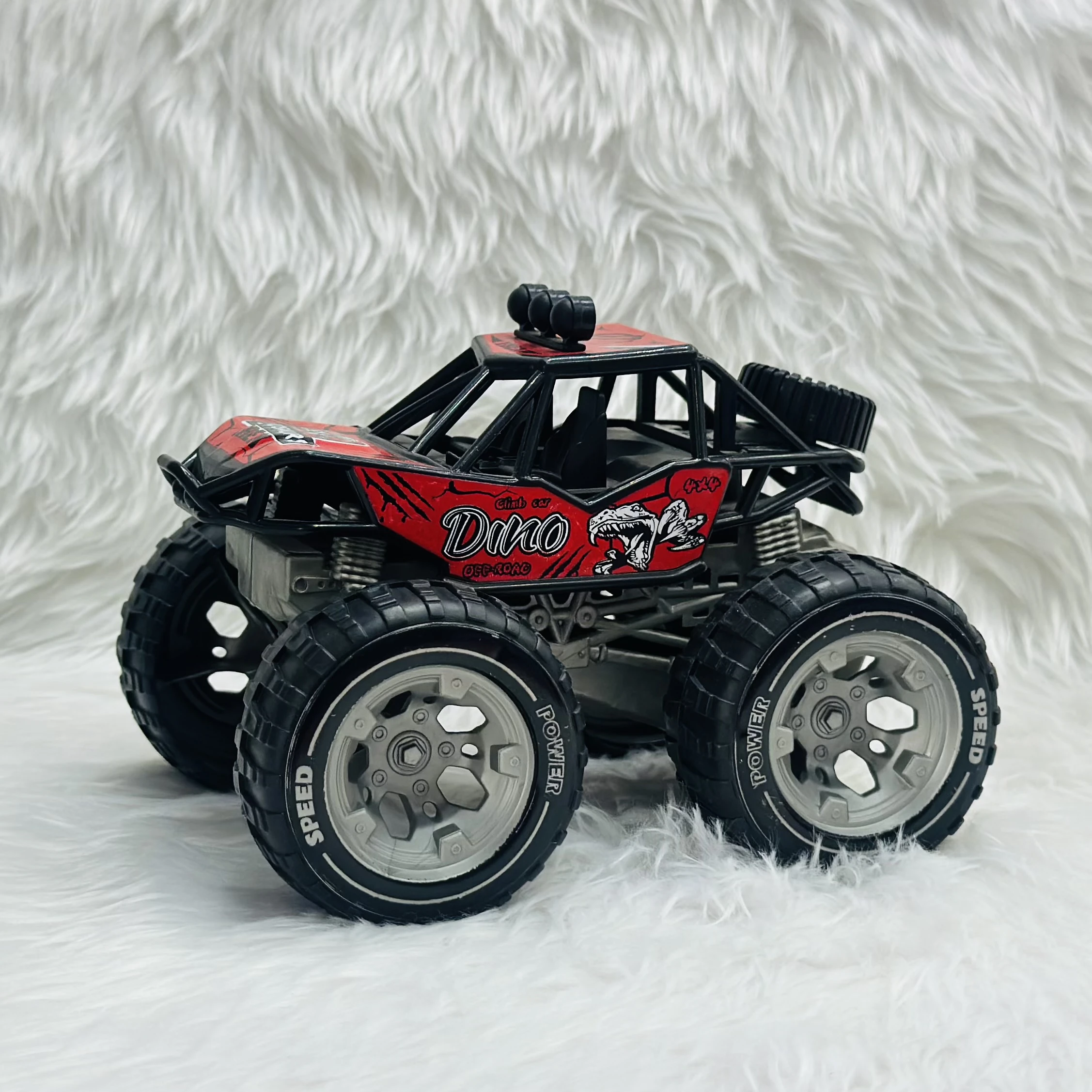 Red "Dino Off-Road" toy monster truck