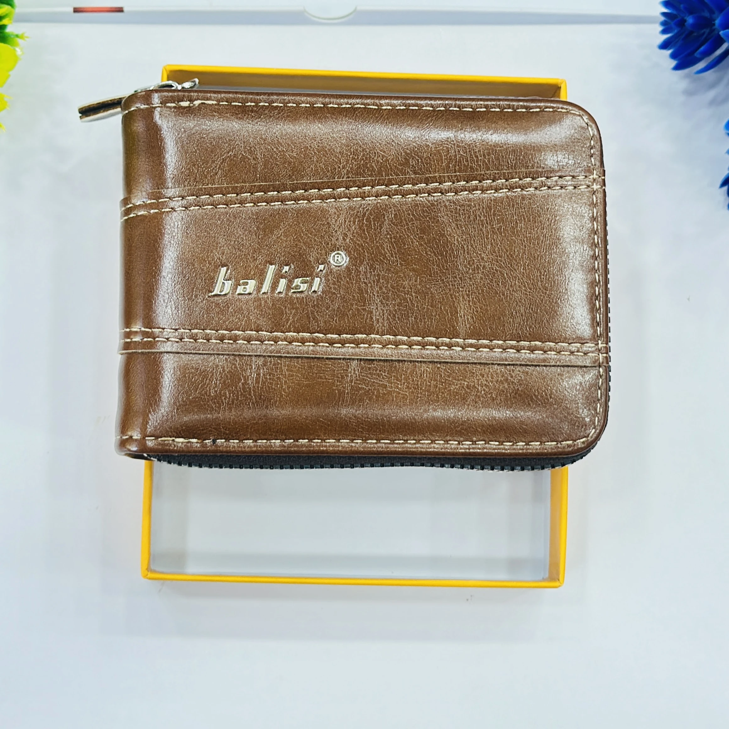 Balisi brand men's wallet is a brown zip-around PU leather wallet.