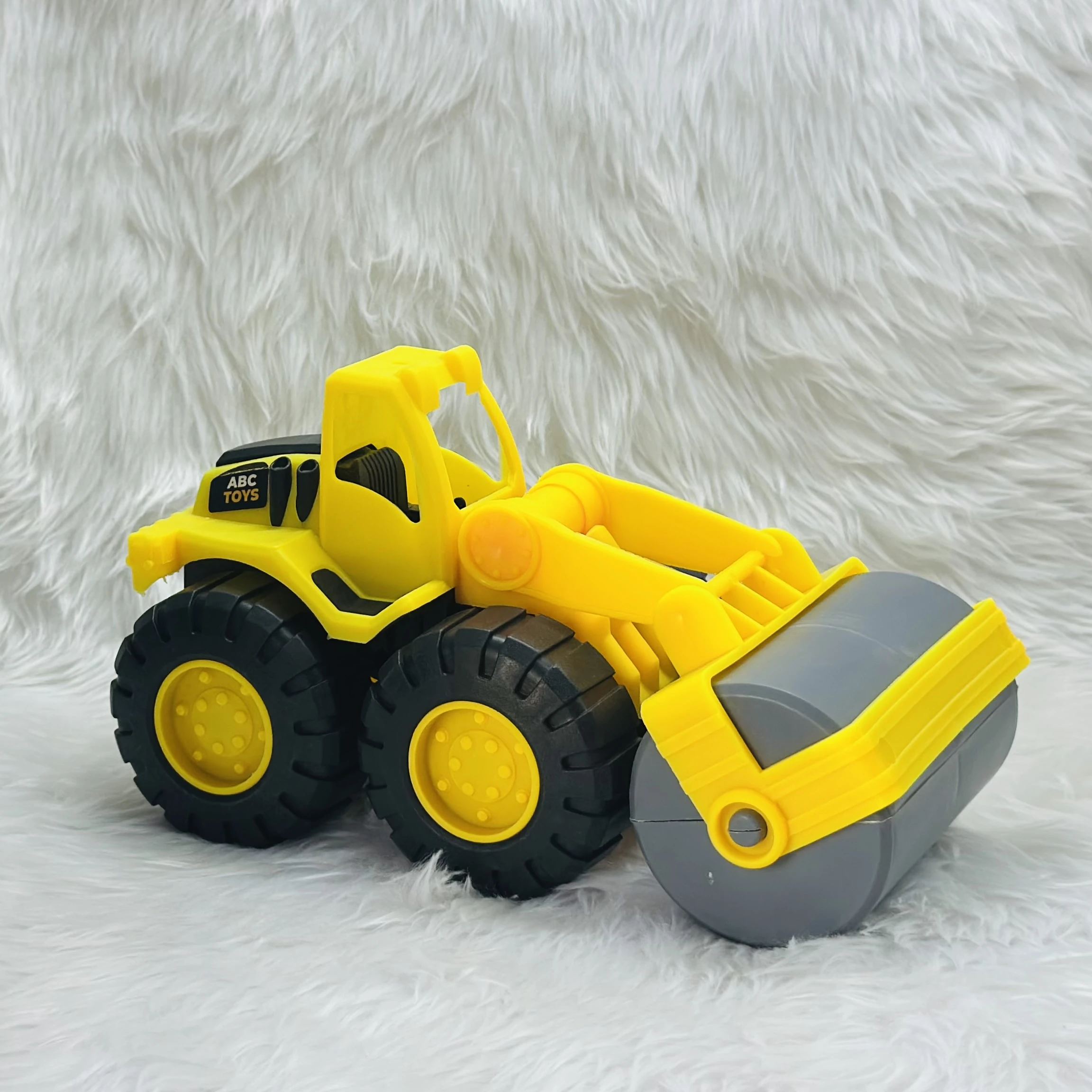 Yellow ABC Toys plastic road roller toy.