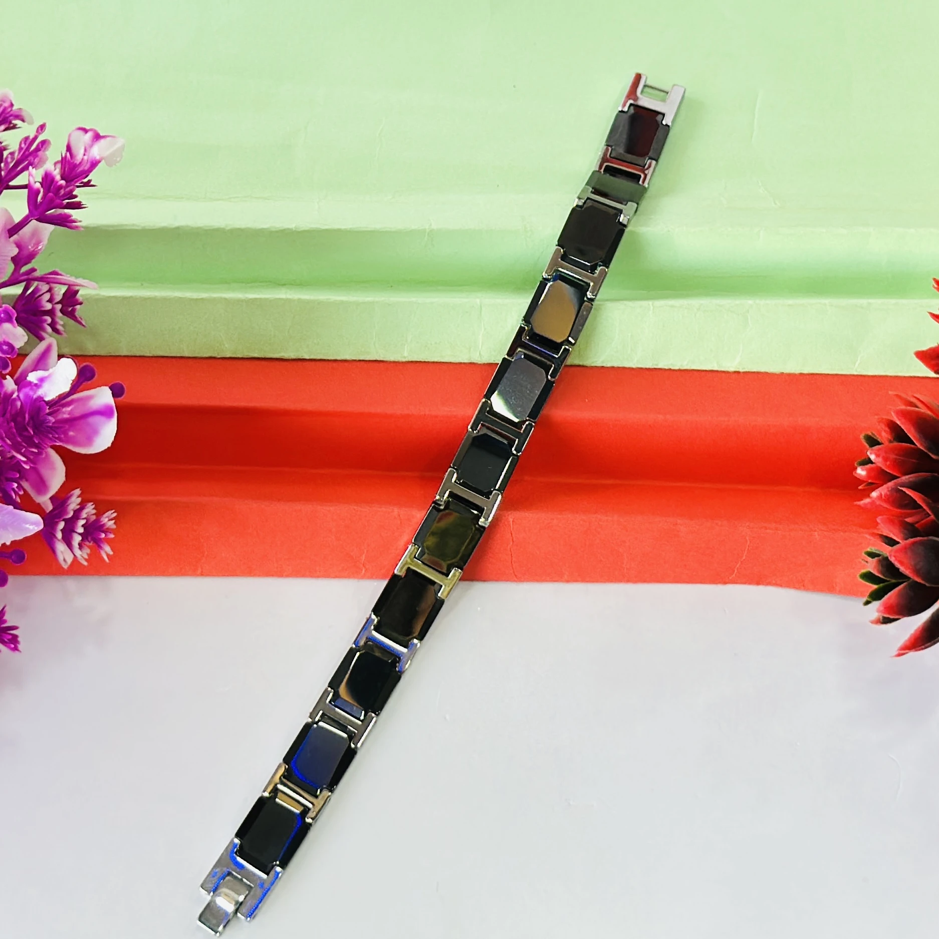 men's stainless steel and black ceramic (or rubber) link bracelet.