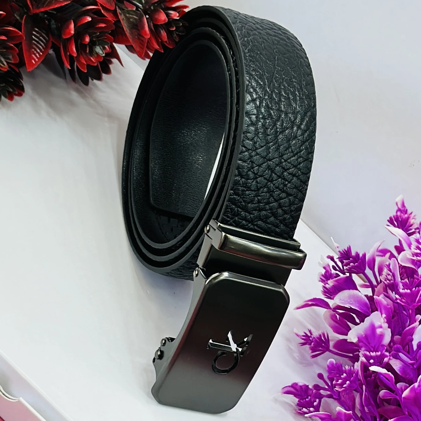 Calvin Klein black genuine leather men's belt with an automatic buckle.