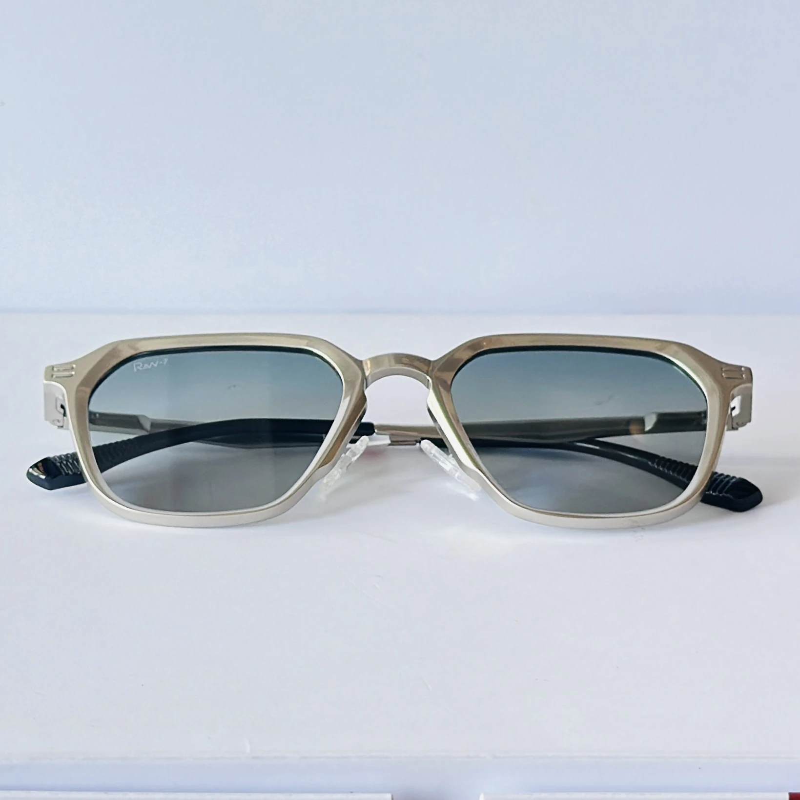 RAV-7 sunglasses feature a sleek black full-rim rectangle frame