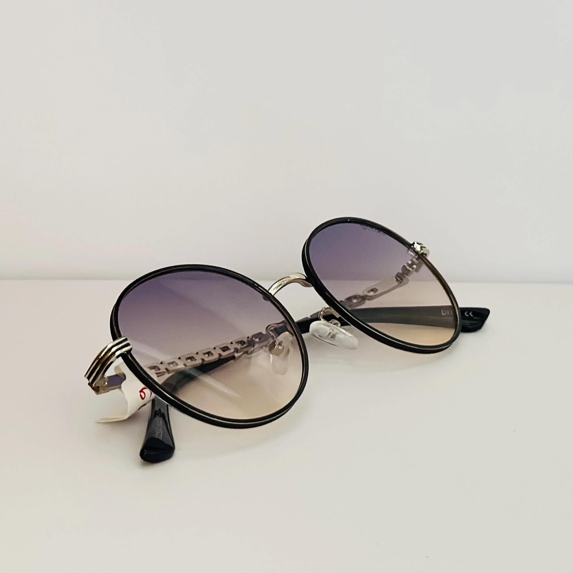 Moncler Tatou ML 0224 sunglasses in  metal with round lenses.