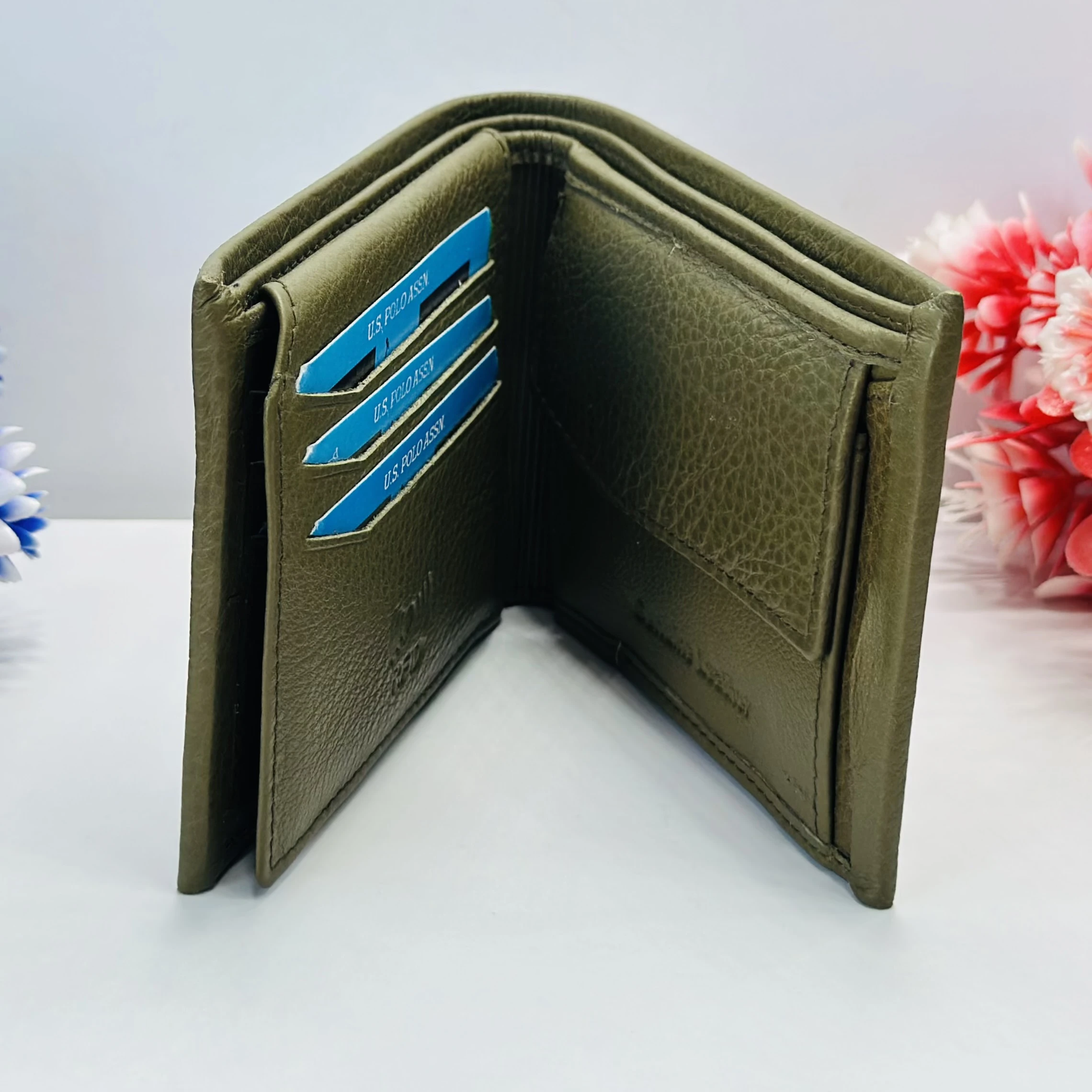 U.S. Polo Assn. bi-fold solid wallet in an olive color.