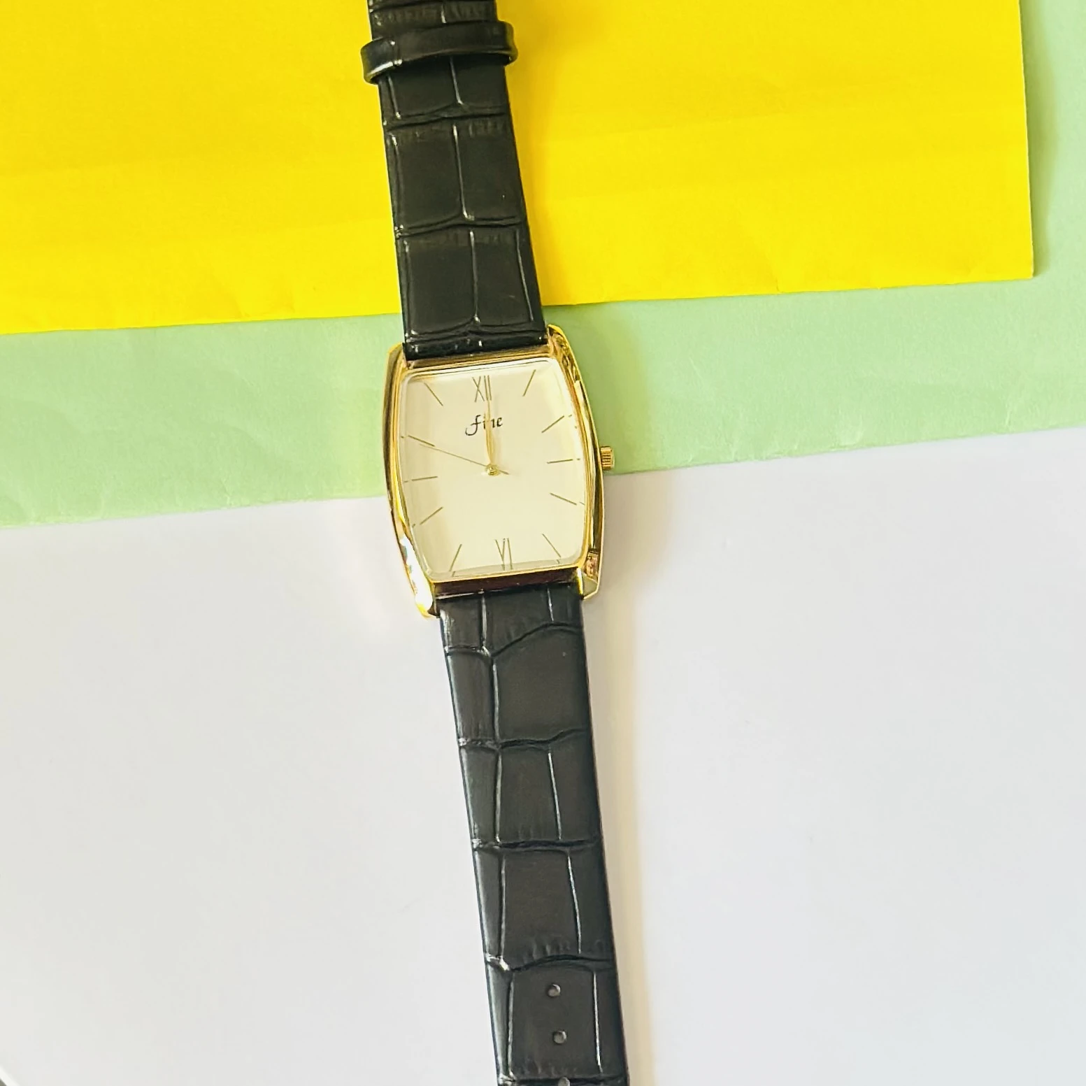 Edge quartz analog white dial black leather strap watch.
