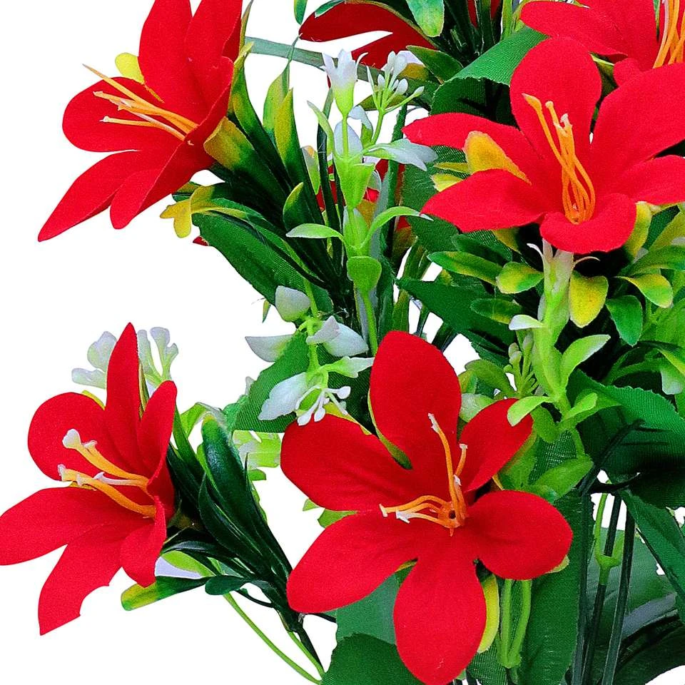 lily flower arrangement in a white pot.