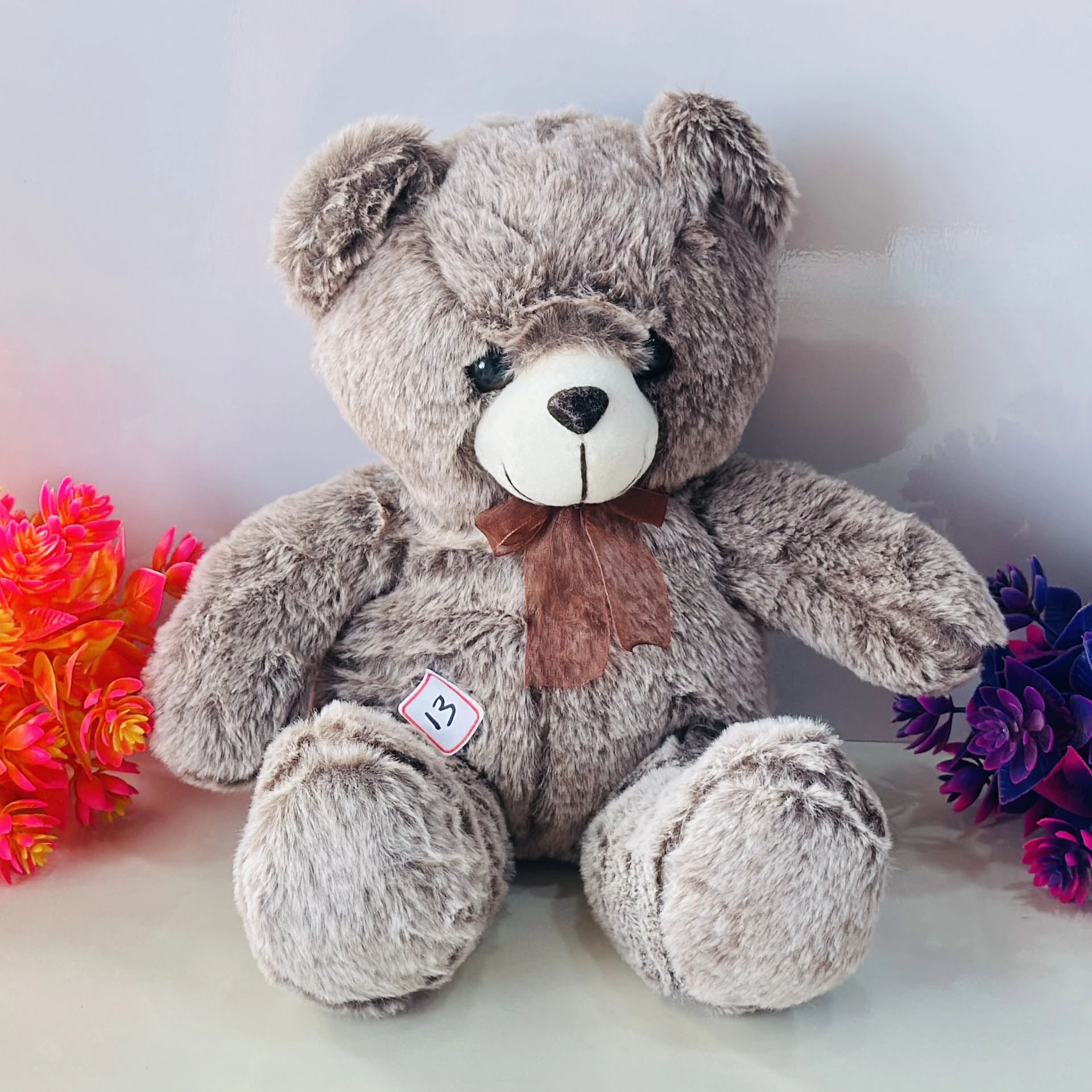 Light grey plush teddy bear