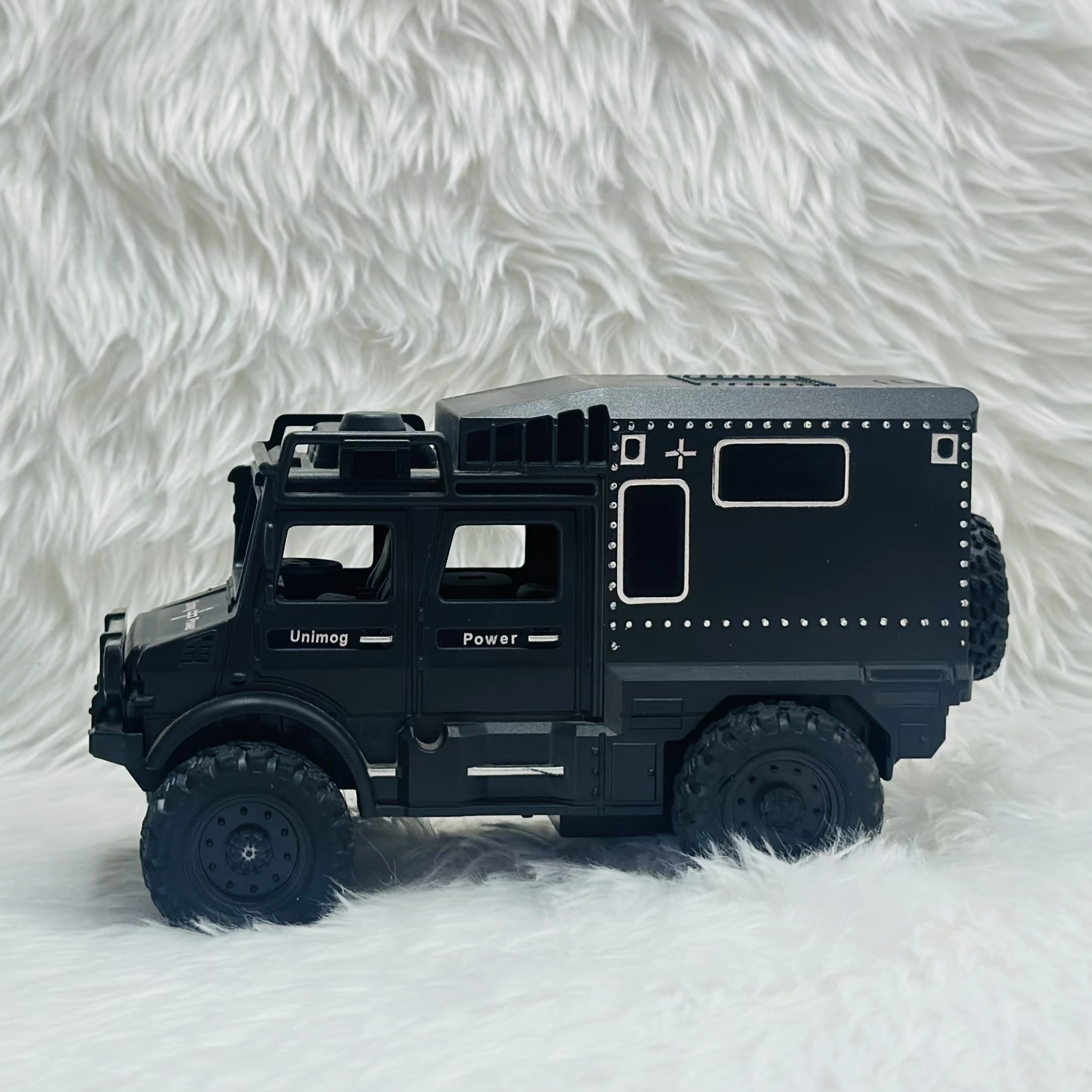 Toy Club Unimog army truck toy.