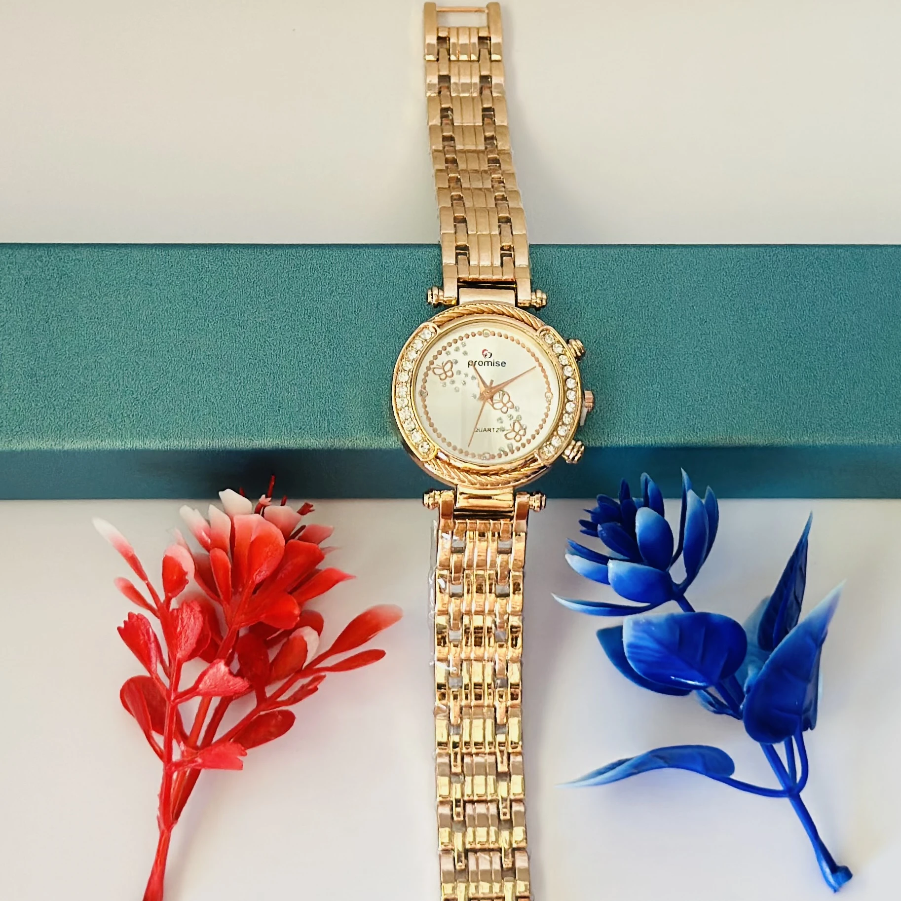 Promise Quartz watch with a rose gold-tone stainless steel bracelet