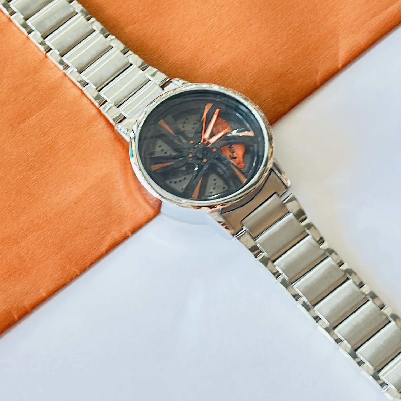 spinning car wheel rim-themed watch