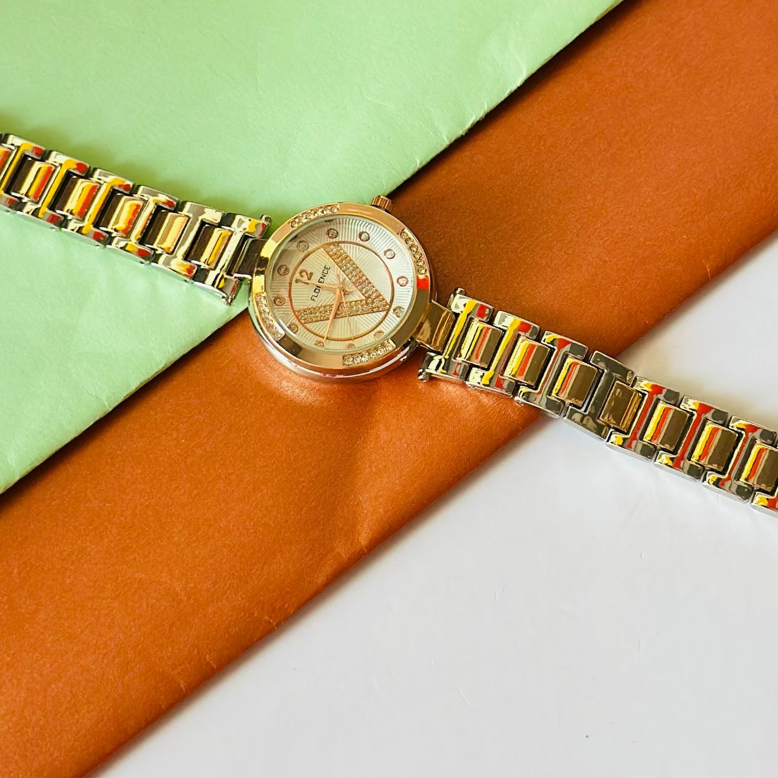 Florence brand two-tone metal analog watch for women.