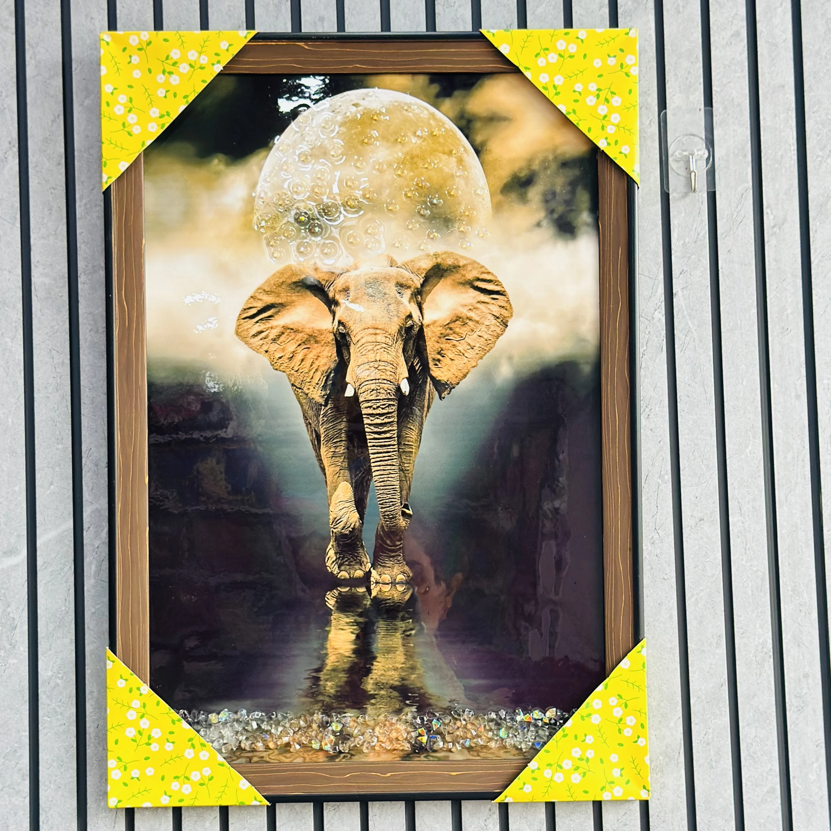 An elephant walking under a large moon(SKU-0OUCTP)