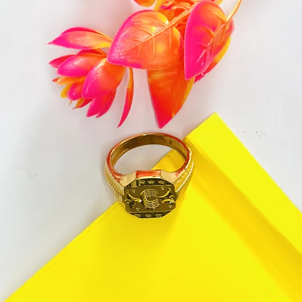 22kt yellow gold men's ring with a matte finish and machine-cut designs.