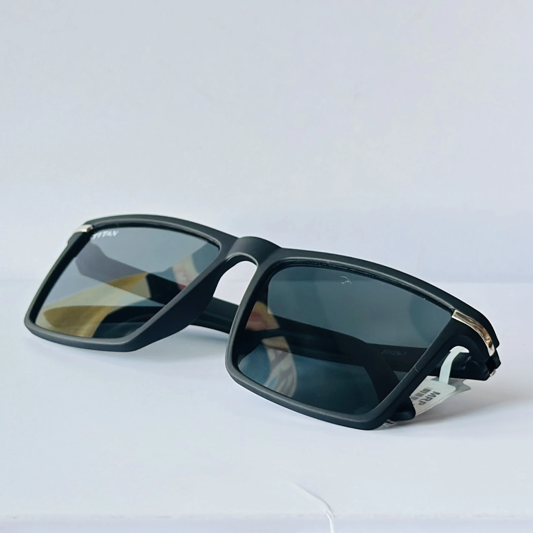 Black rectangular frame with blue-toned lenses.