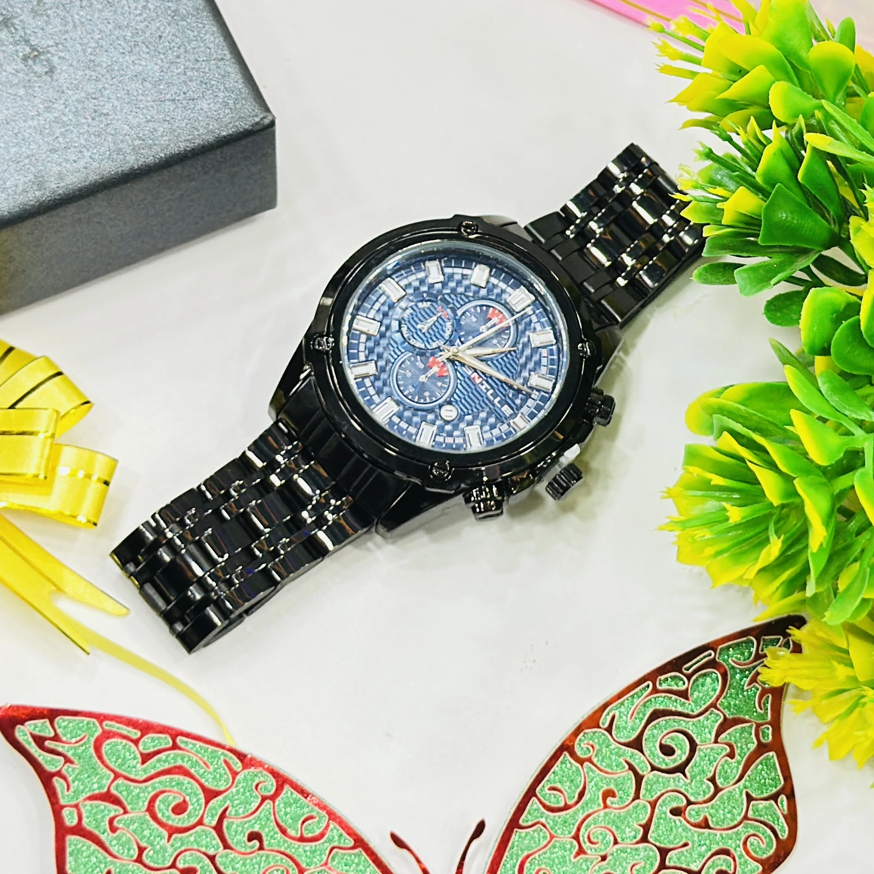 Black metal analog chronograph wristwatch