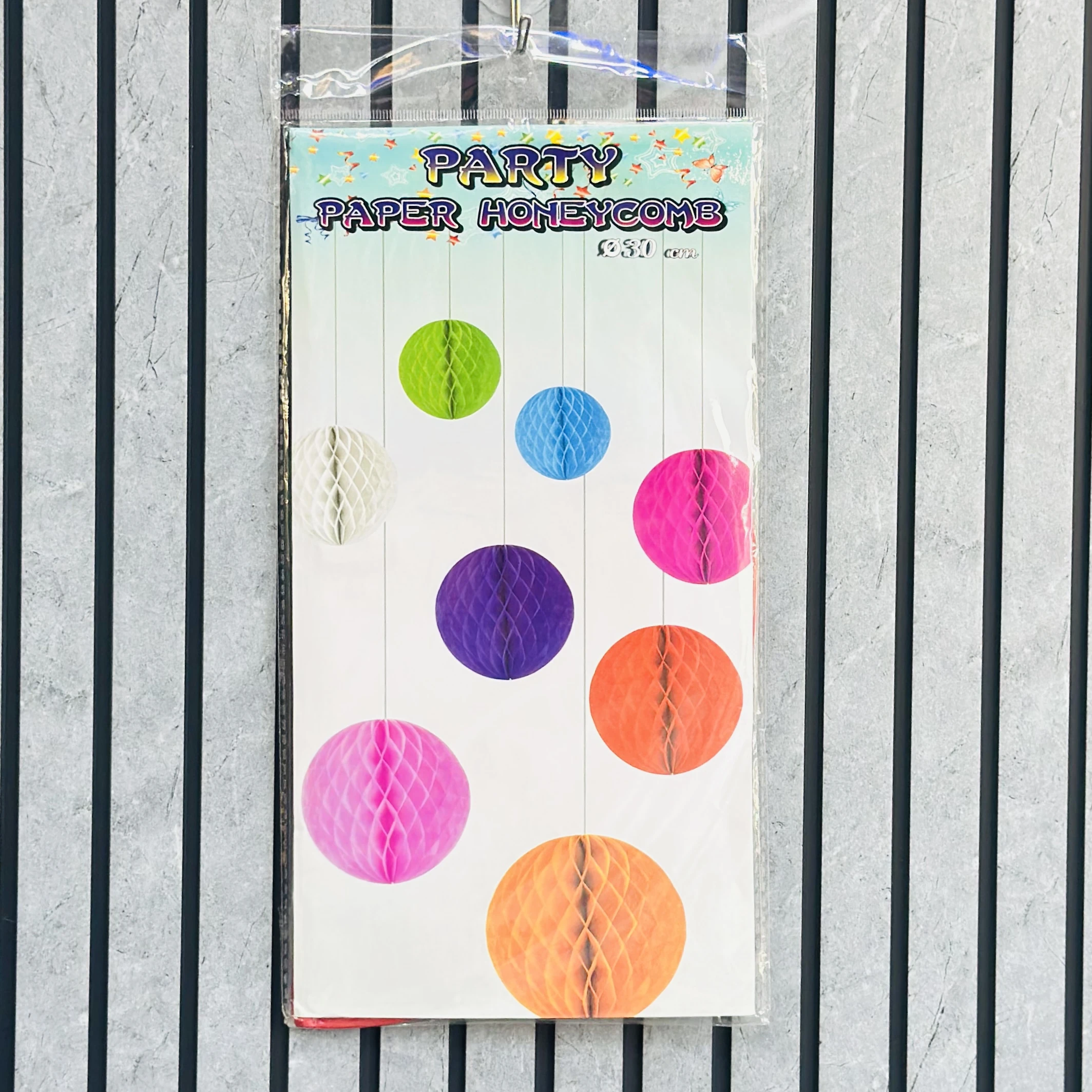 package of honeycomb paper ball decorations.