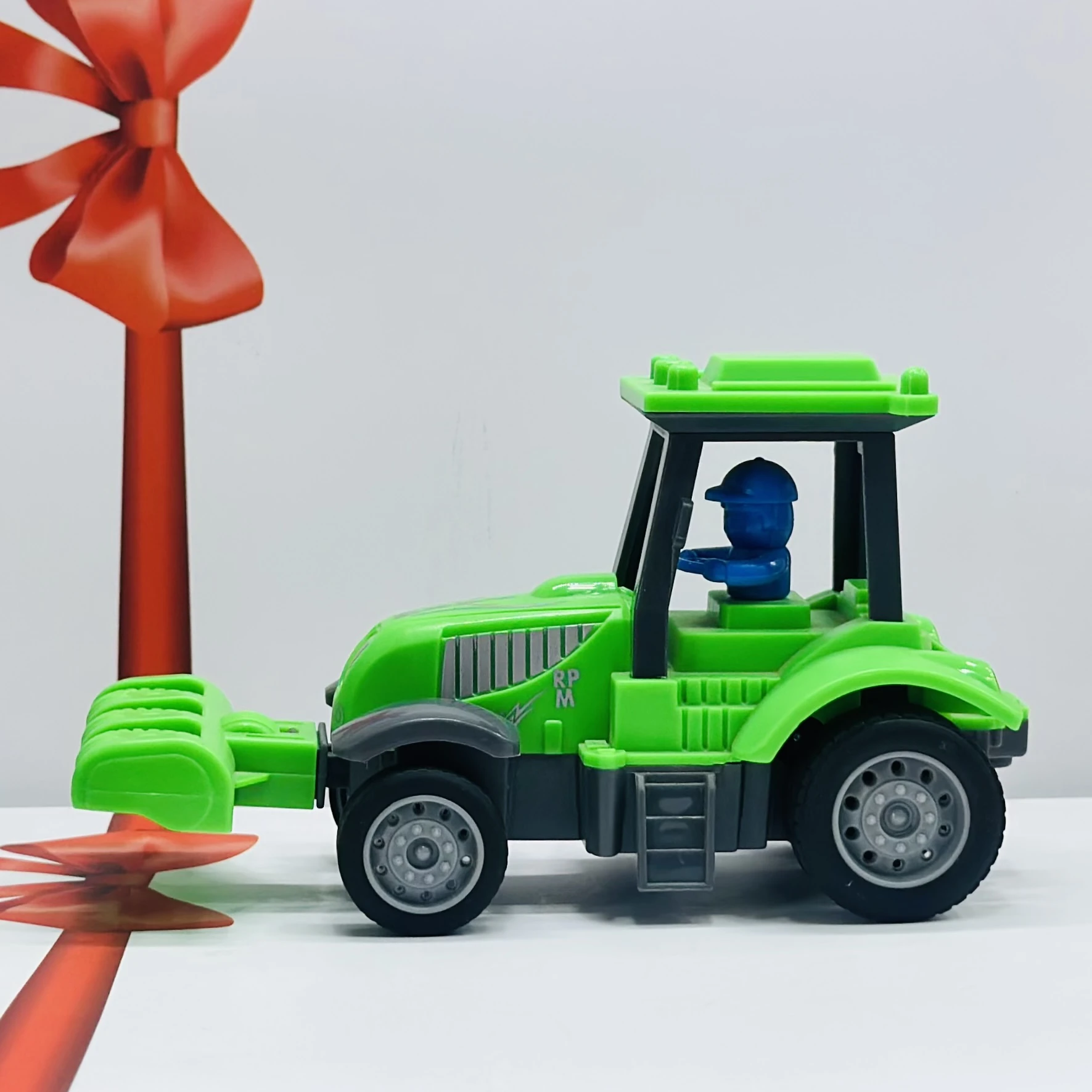 Green plastic toy tractor