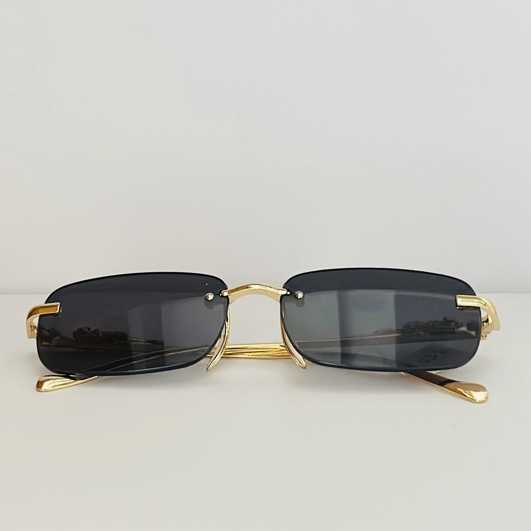 Gucci GG1221S 001 rimless rectangular sunglasses