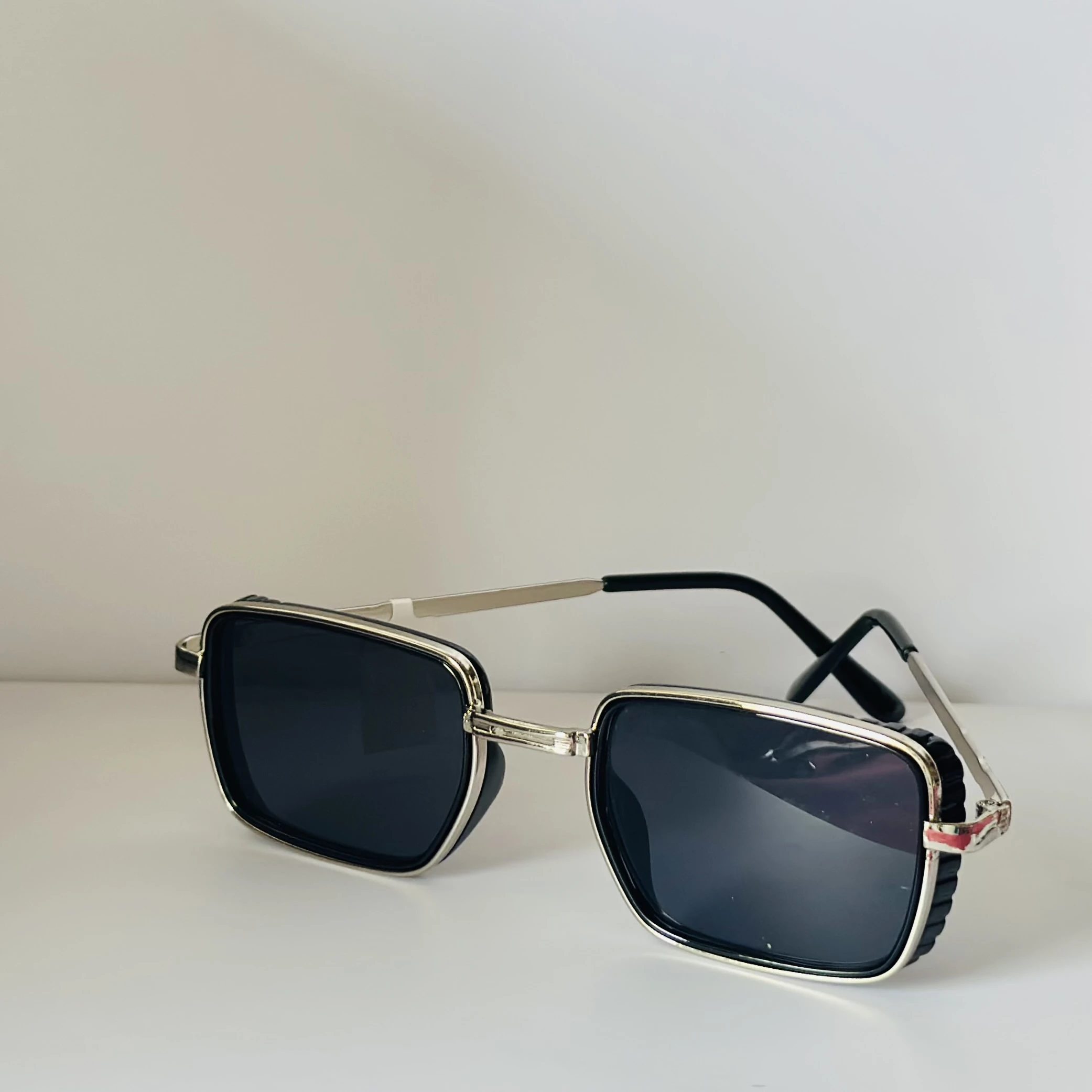 pair of Aedoll Goggle sunglasses with a gold metal frame and pink gradient lenses.
