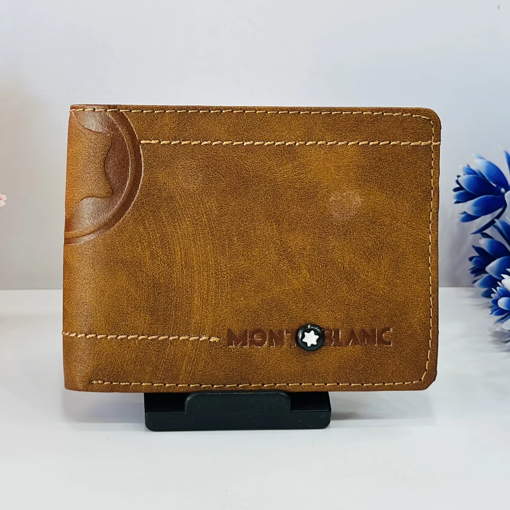 Brown bifold leather wallet in a Montblanc gift box.
