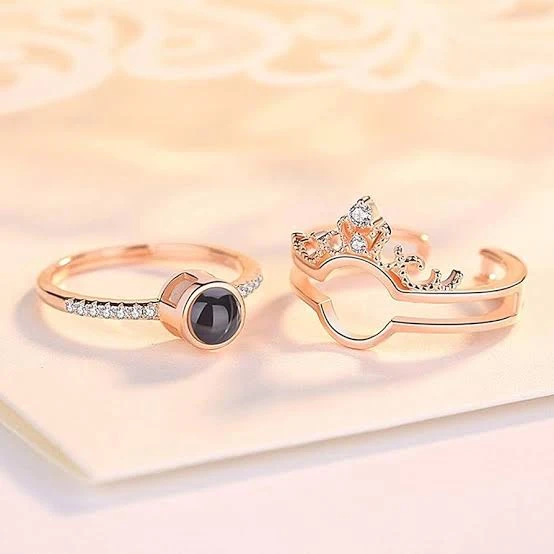 crown-design "I Love You" in 100 languages projection ring, often made from a zinc alloy or artificial material.