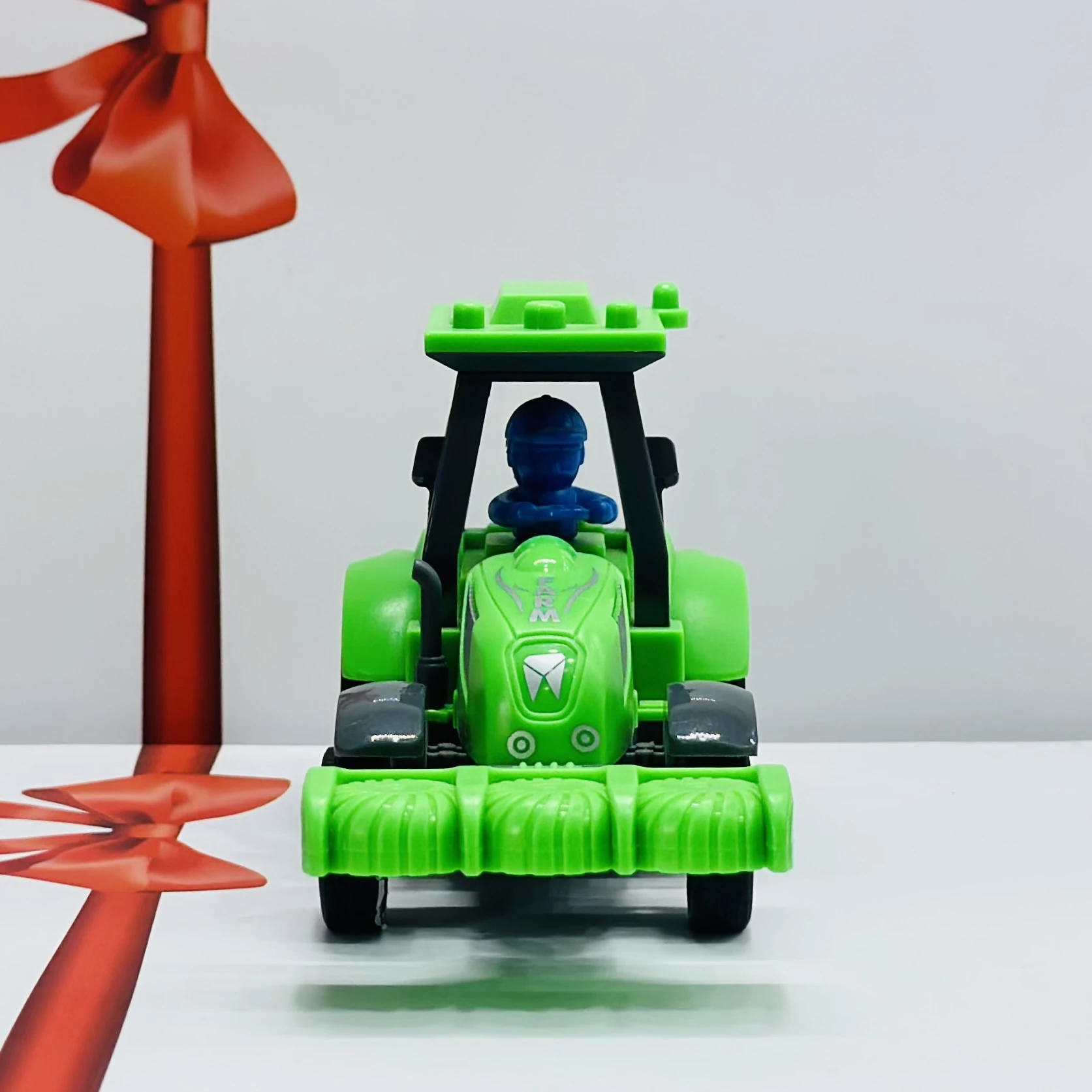 Green plastic toy tractor