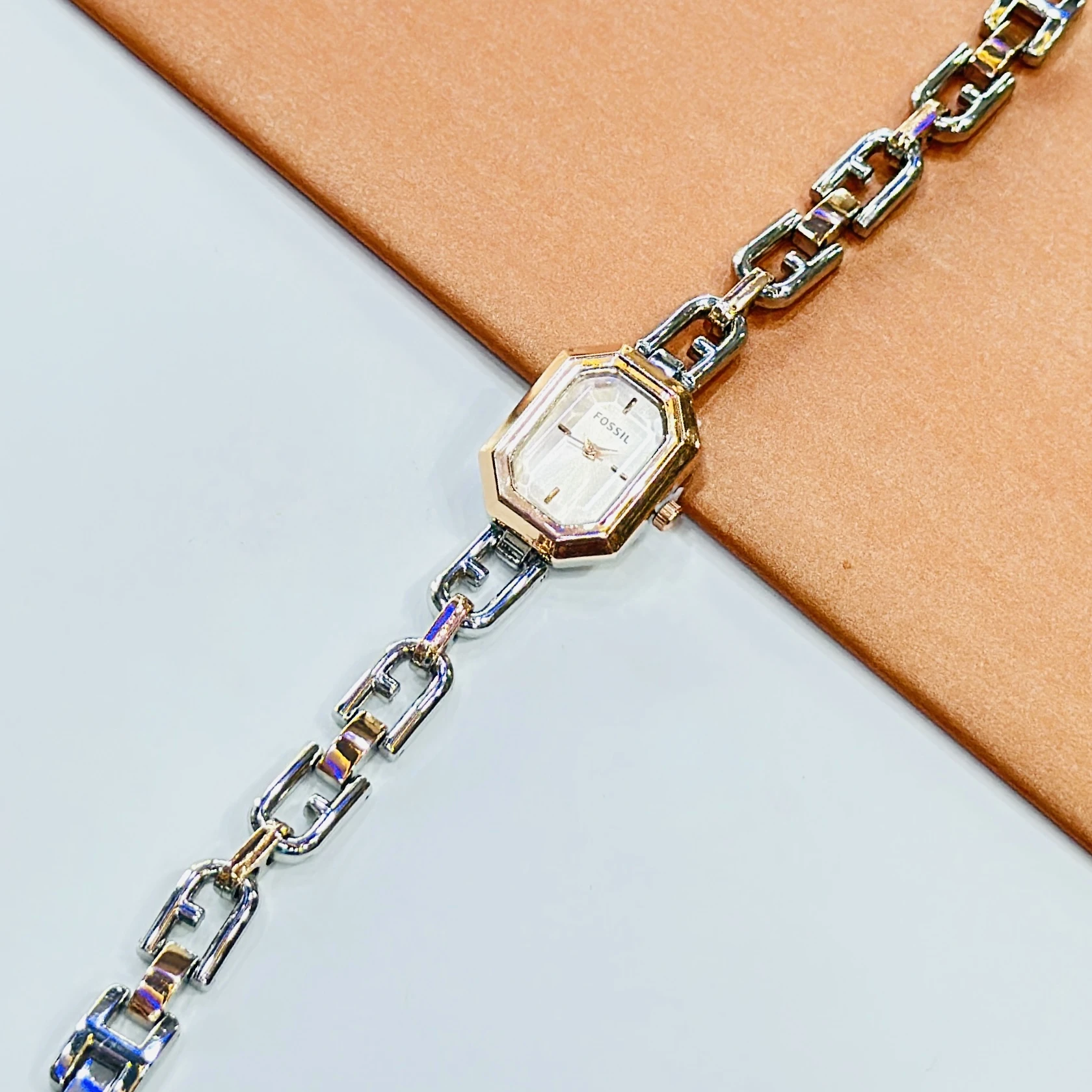 Fossil Harlow Mini two-hand rose gold-tone watches with chain bracelets.