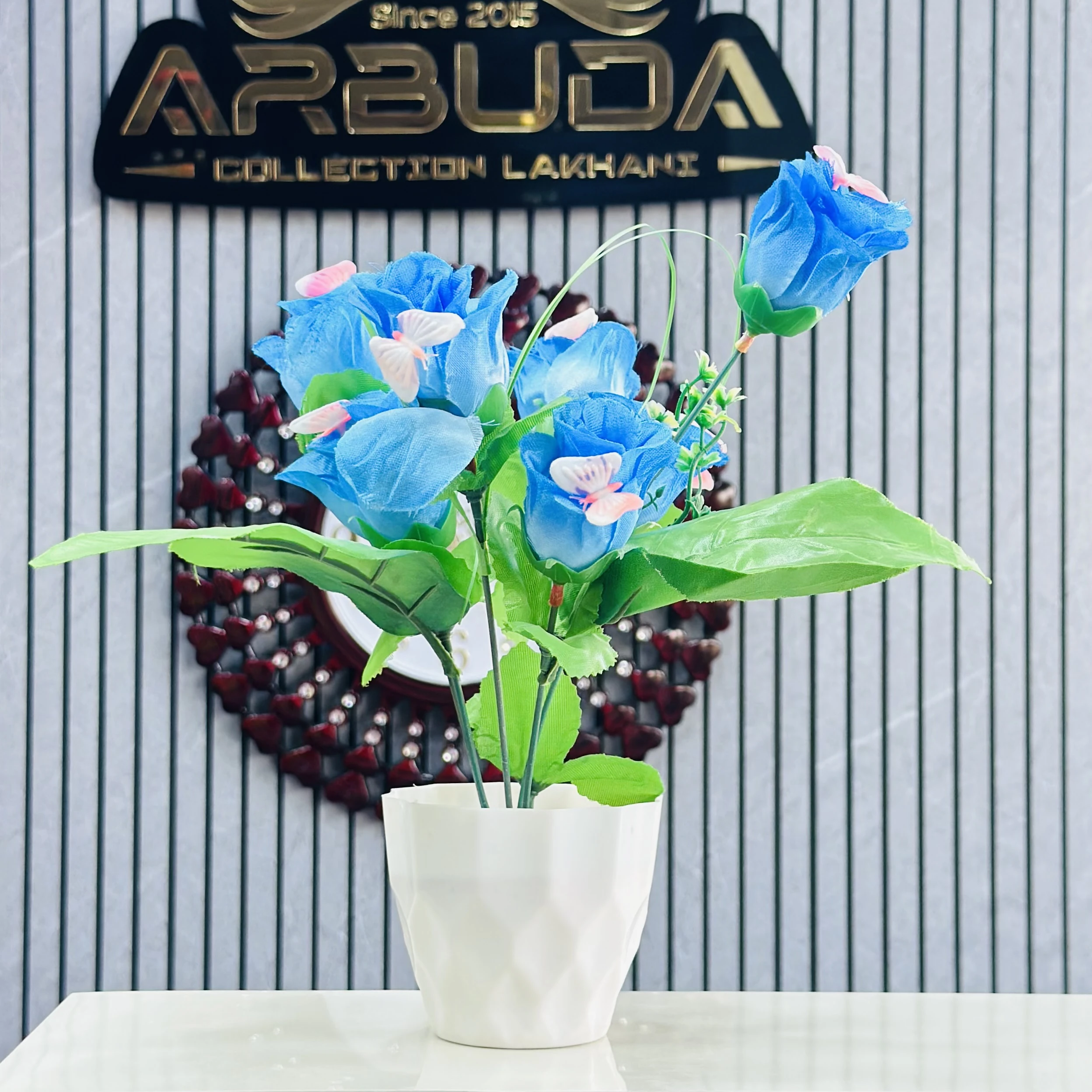 Blue rose flower bunch in a white plastic pot.