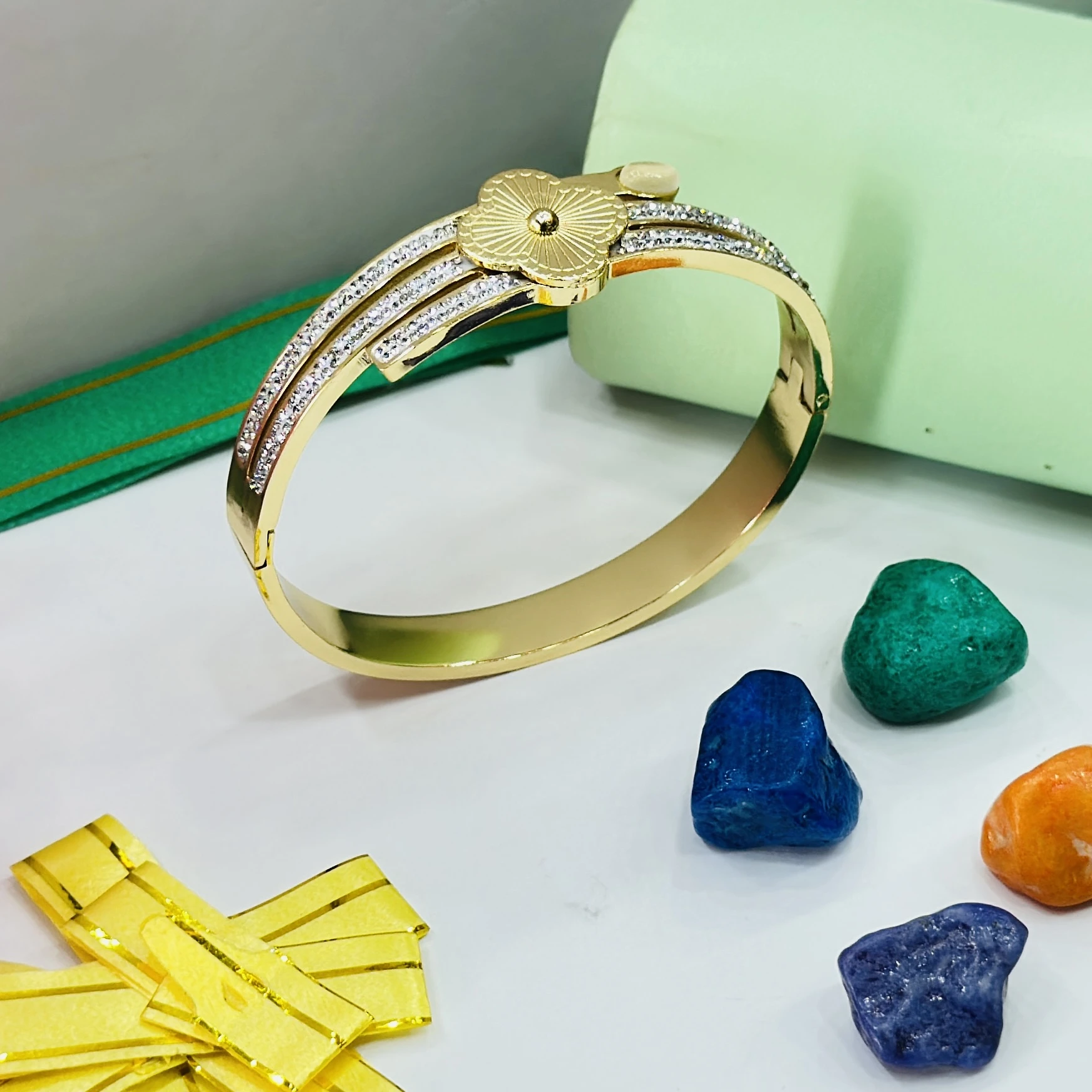 Gold toned stainless steel openable bangle bracelet