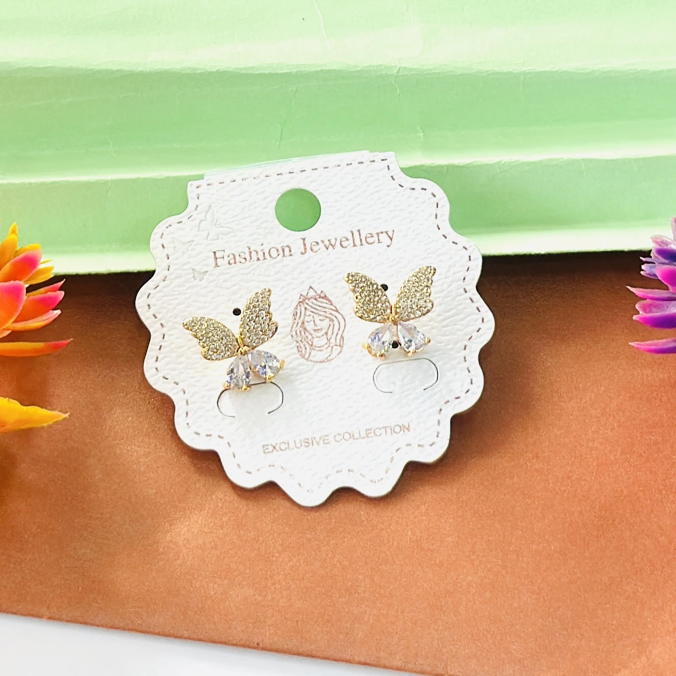 Gold toned, butterfly-shaped stud earrings