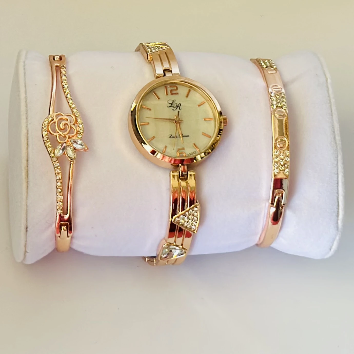 women's watch and bracelet set in rose gold color.