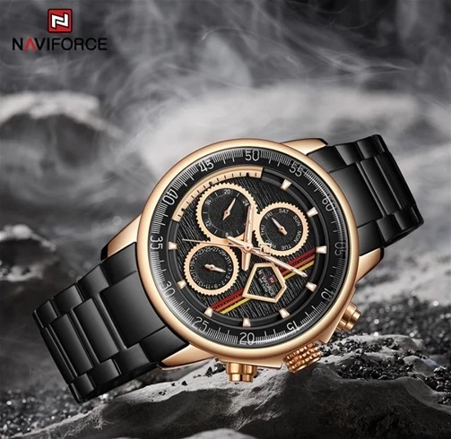 Men’s watch with a black dial and rose gold accents.