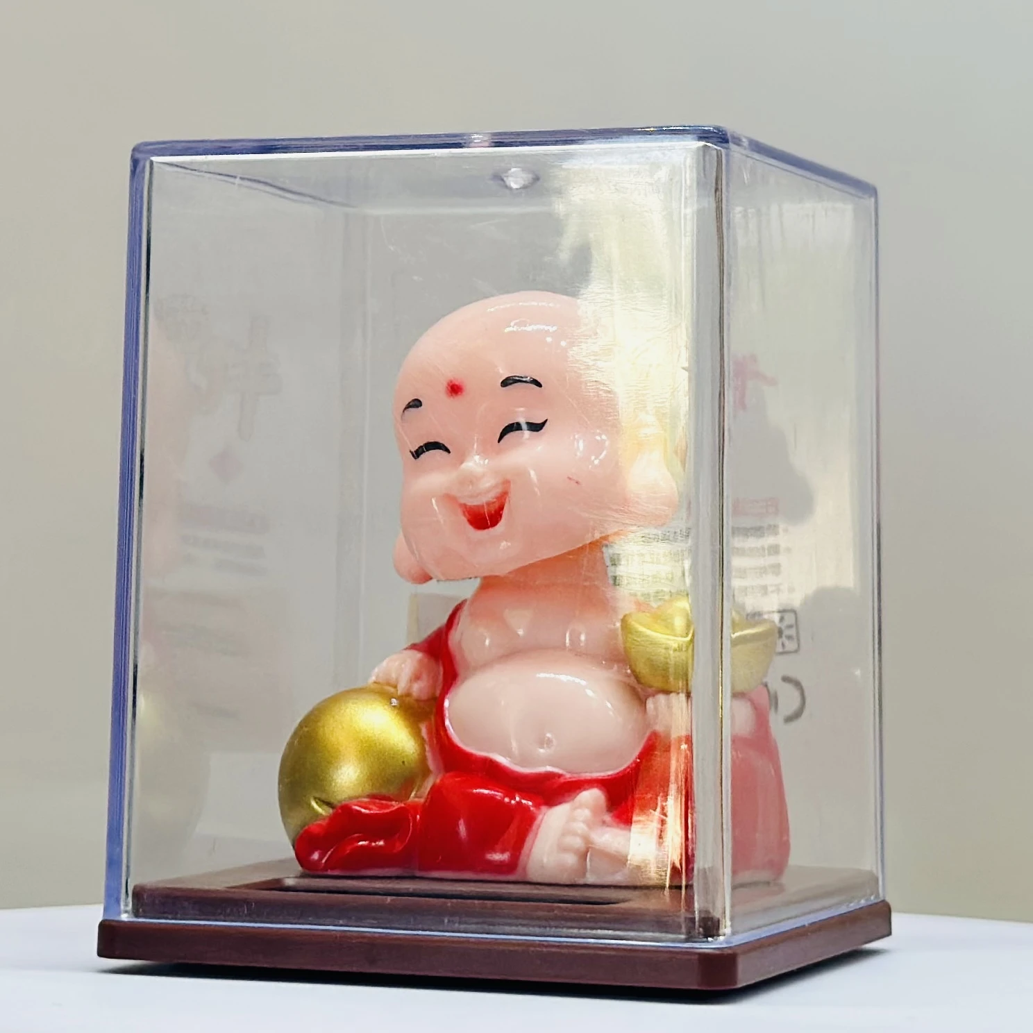 solar-powered smiley figurine