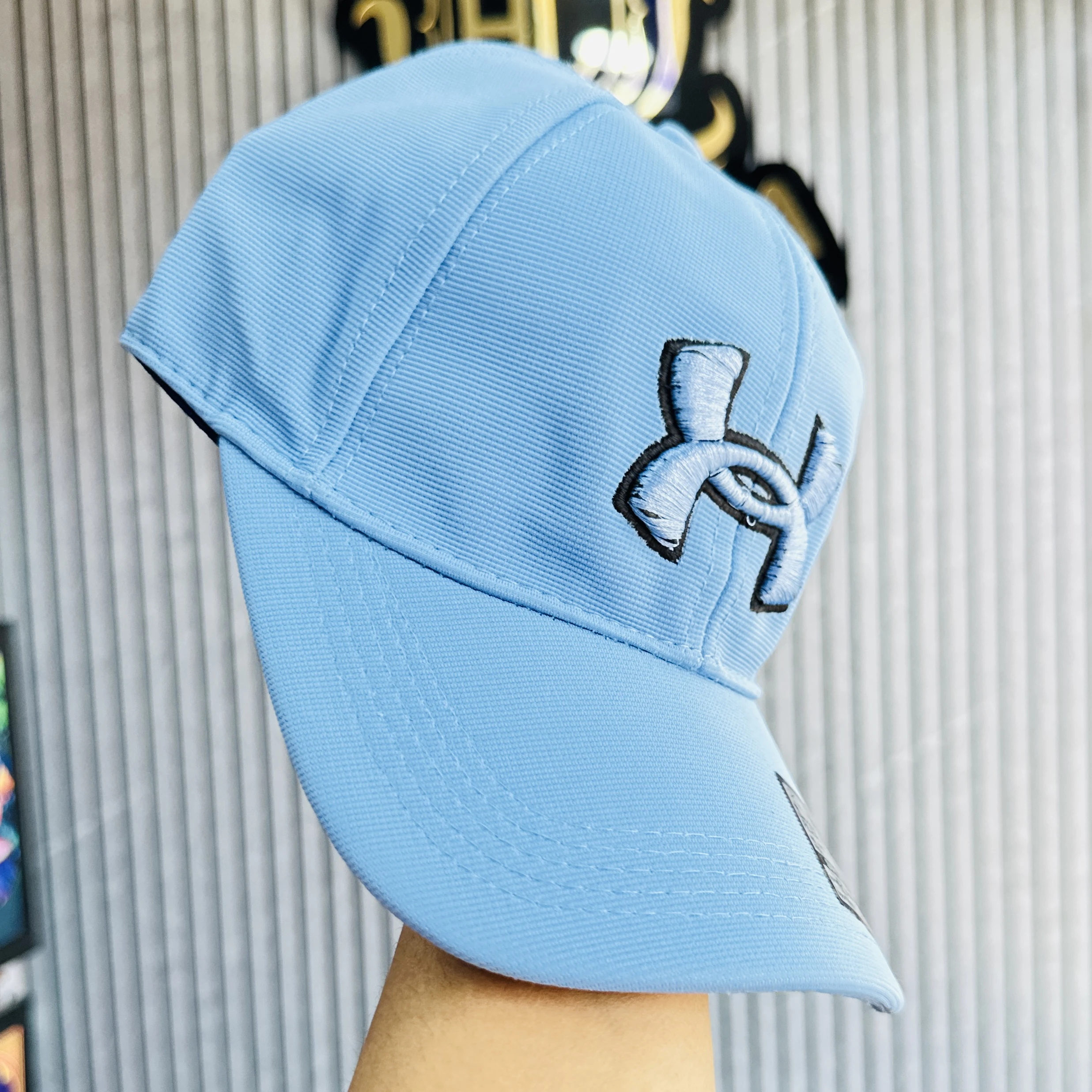 light blue Under Armour Golf96 baseball cap