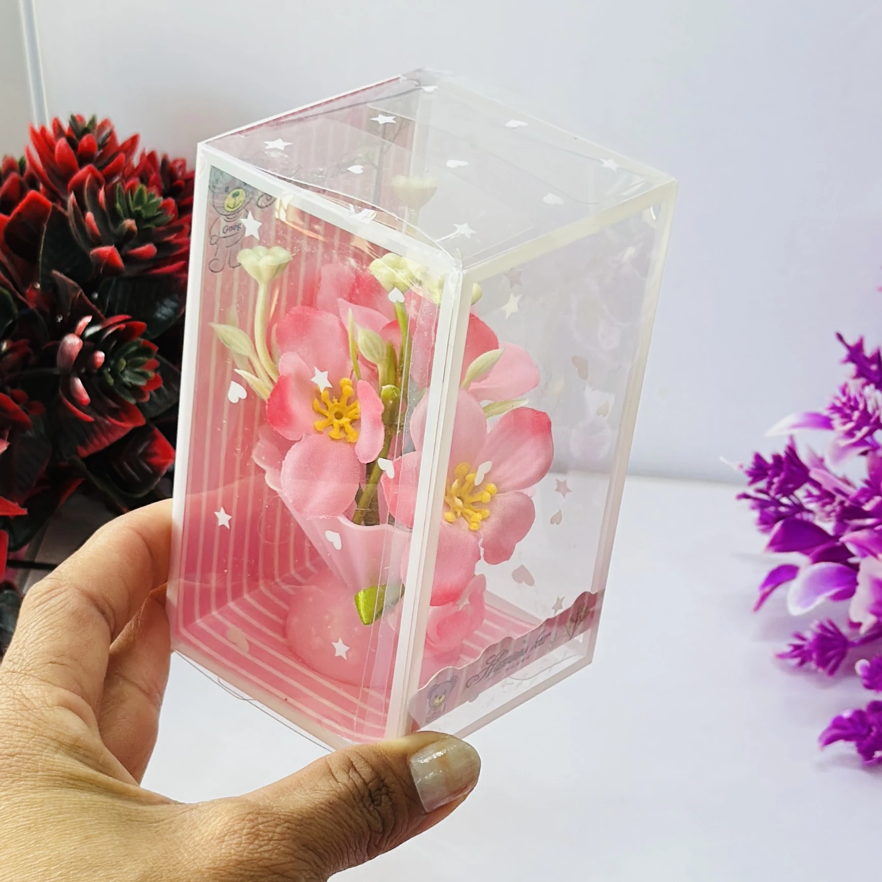 Set of artificial pink tulip flowers presented in a decorative gift box.