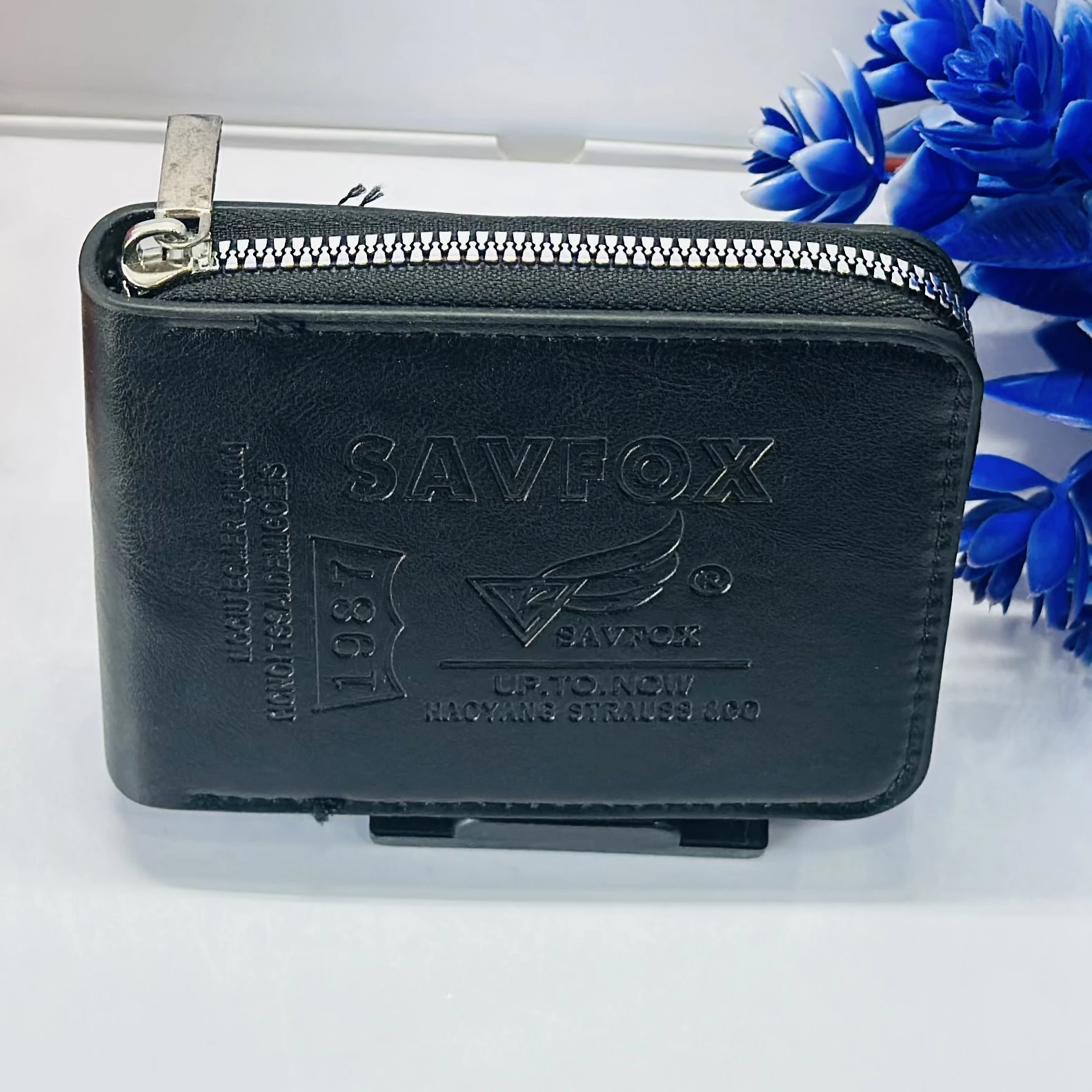 Black faux leather bi-fold wallet by Savfox.
