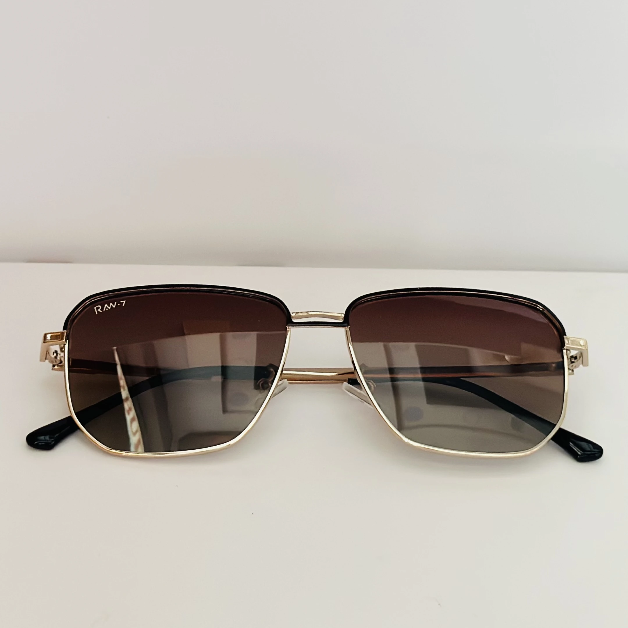 Victoria Beckham VB207S sunglasses in gold with brown gradient lenses.