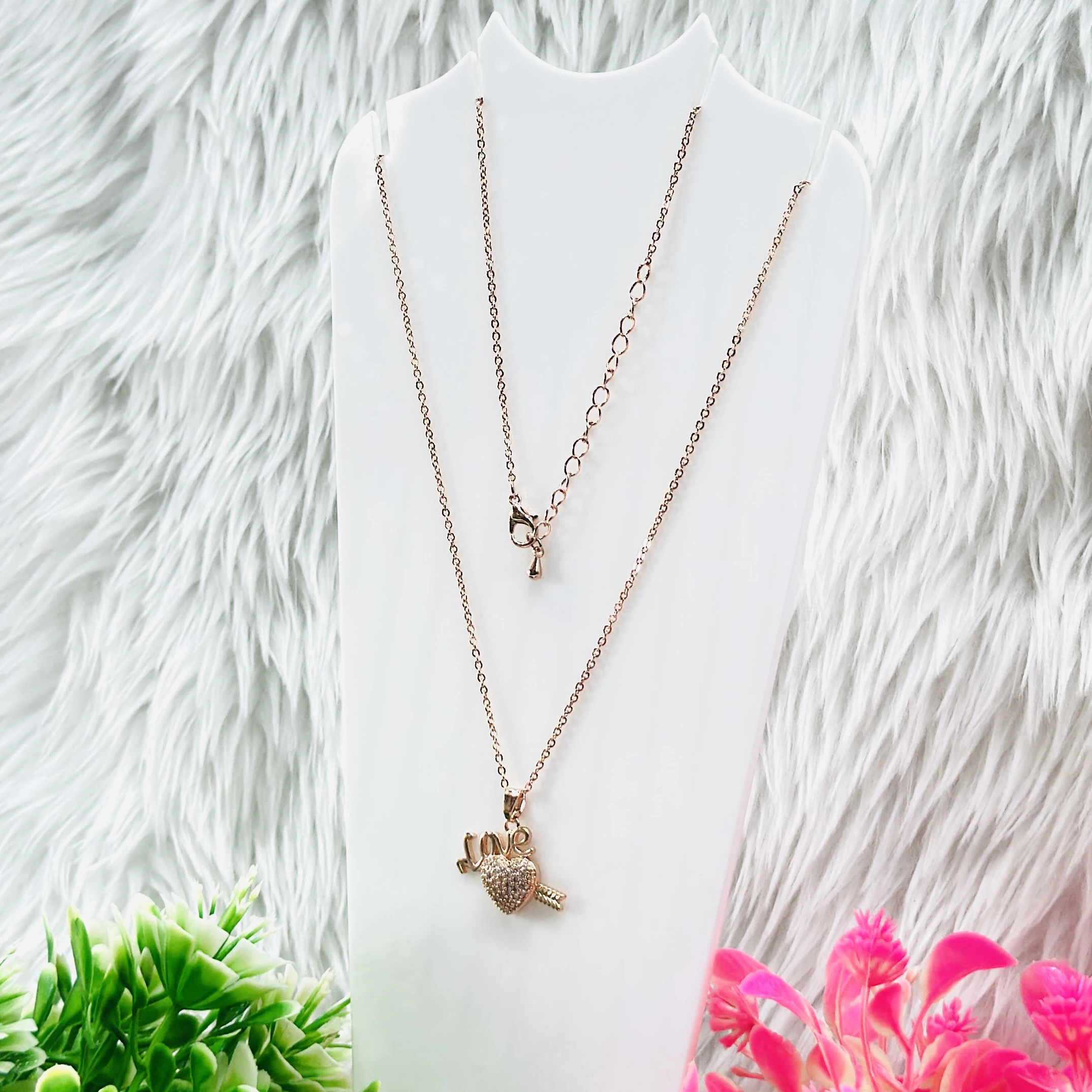 Rose gold necklace set features a heart pendant