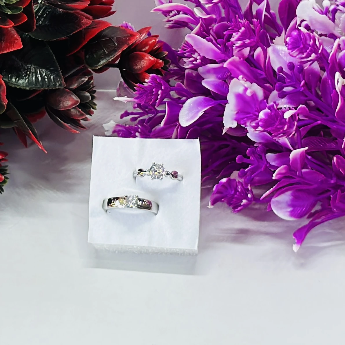 set of silver-plated, stone-studded, adjustable couple rings.
