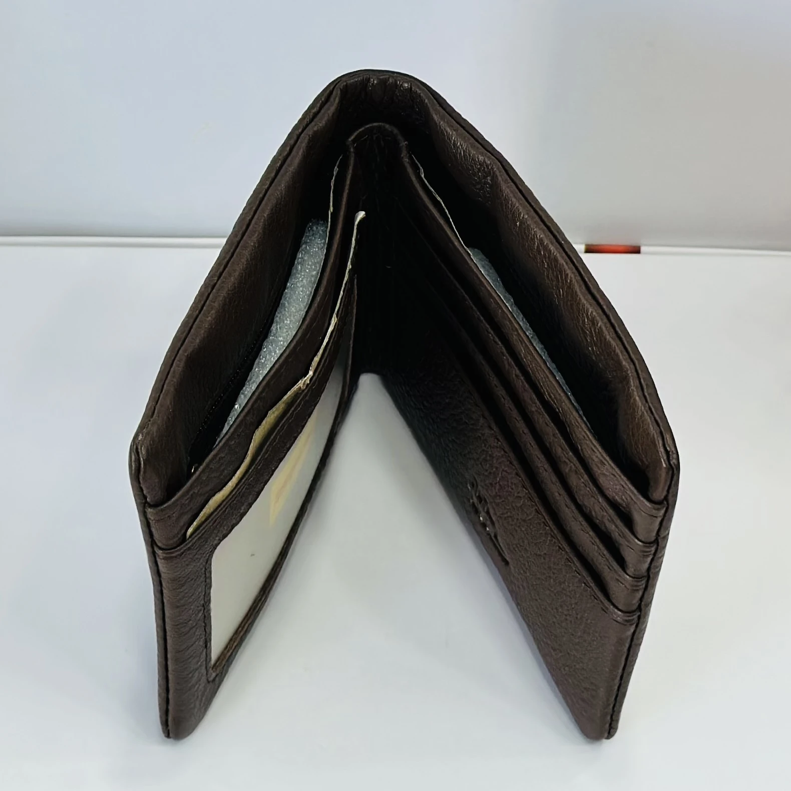 Brown leather bifold men's wallet.