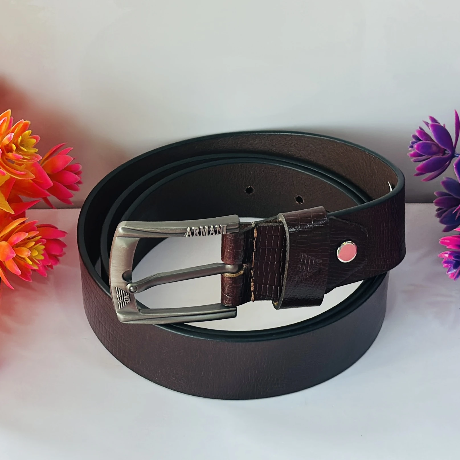 Brown Armani leather belt with a silver-tone buckle.