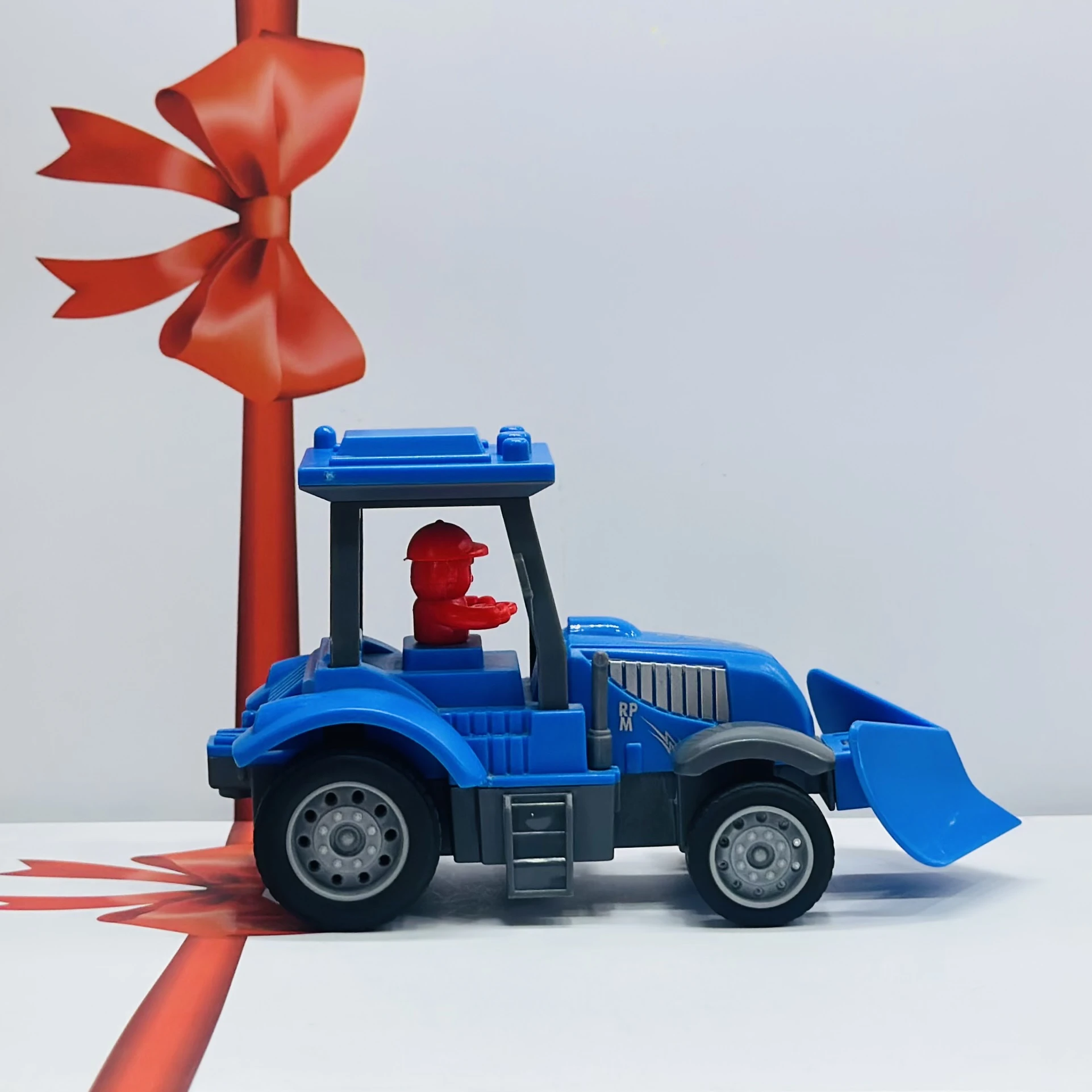Blue plastic toy tractor