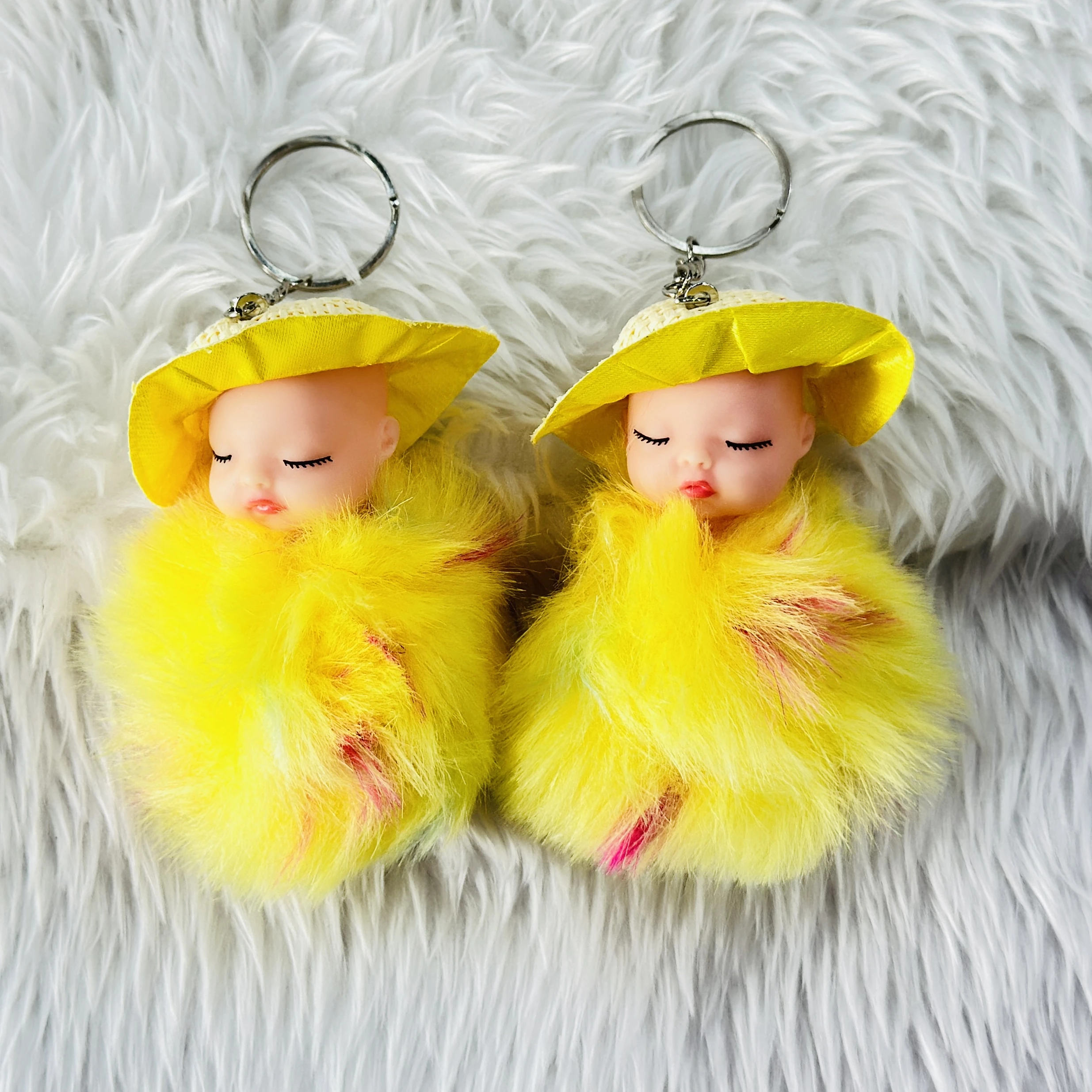 SRG Cute Sleeping Furry Baby doll with cap" keychain