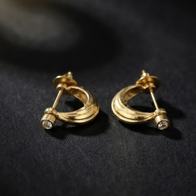 Gold plated crescent-shaped half hoop earrings