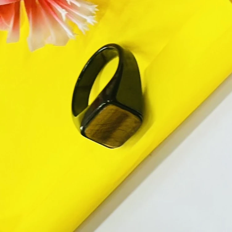 Chimes stainless steel black ring with a square-shaped crystal.