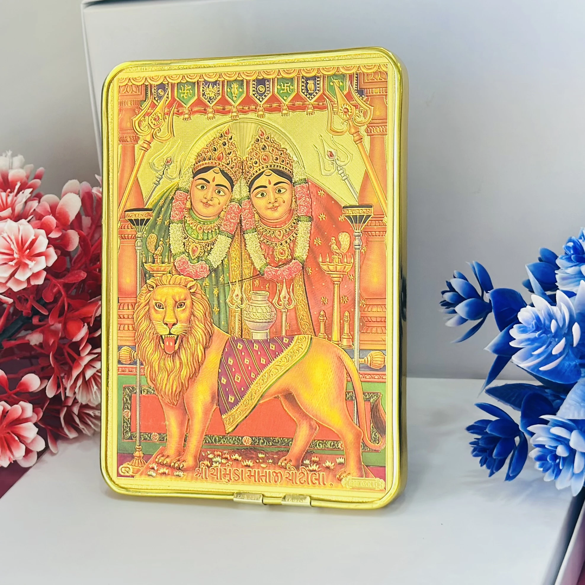 Golden foil photo frame of Shri Chamunda Mataji.