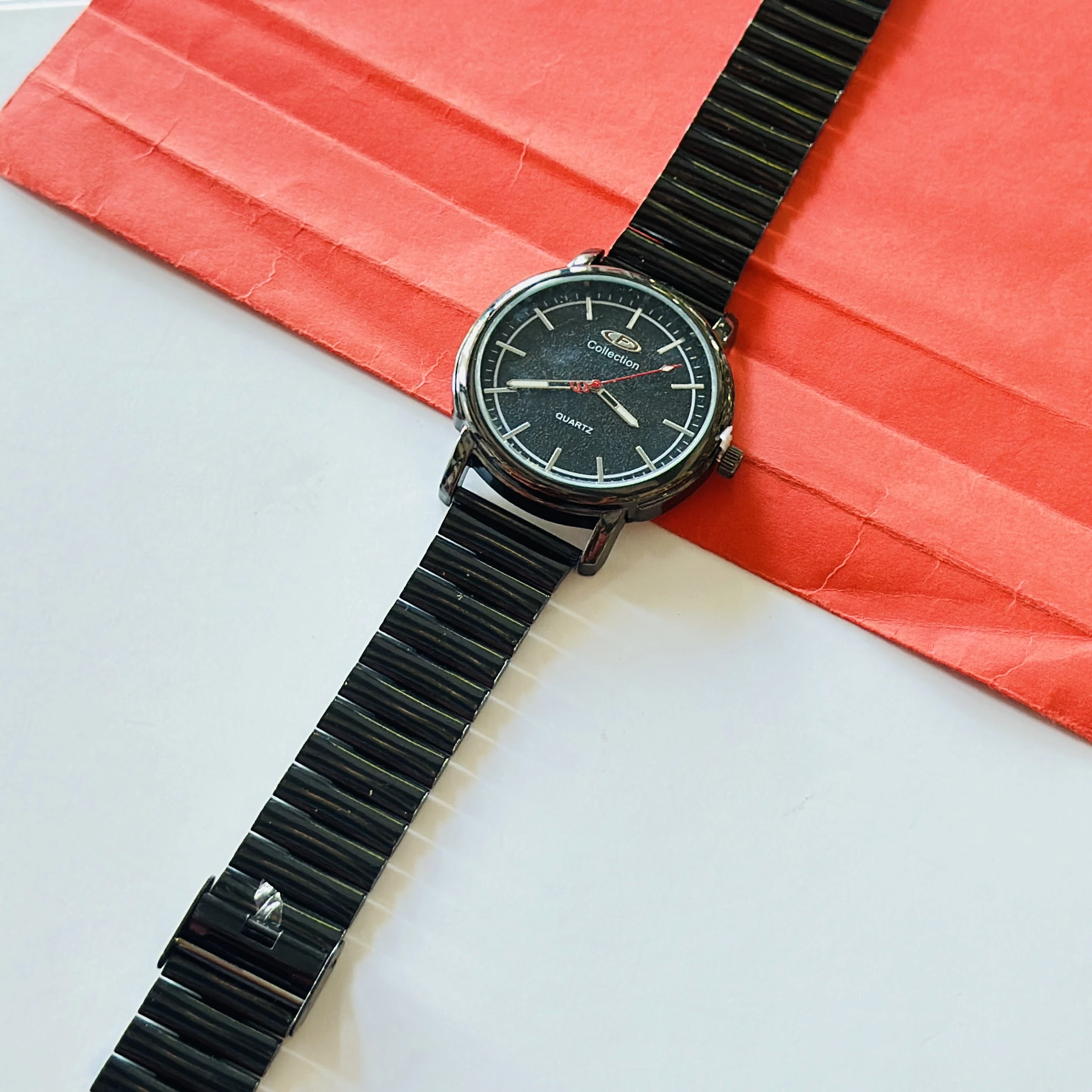 Limestone brand analog wrist watch featuring a black dial and a black band