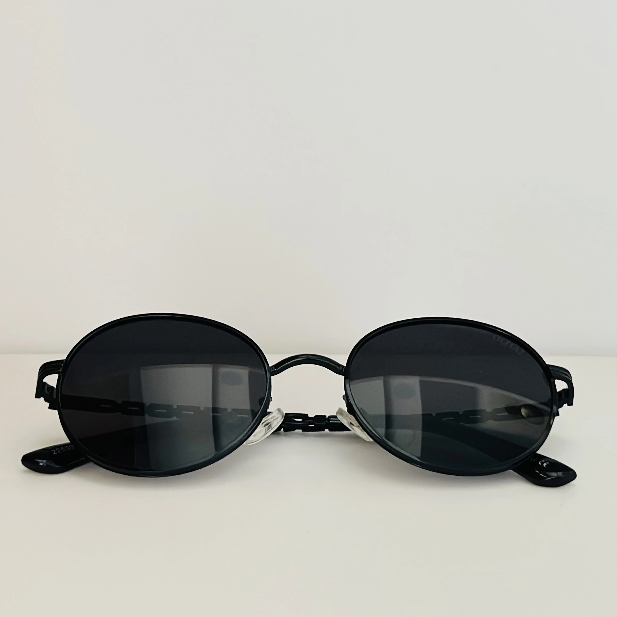 Moncler Tatou ML 0224 sunglasses in black metal with round lenses.